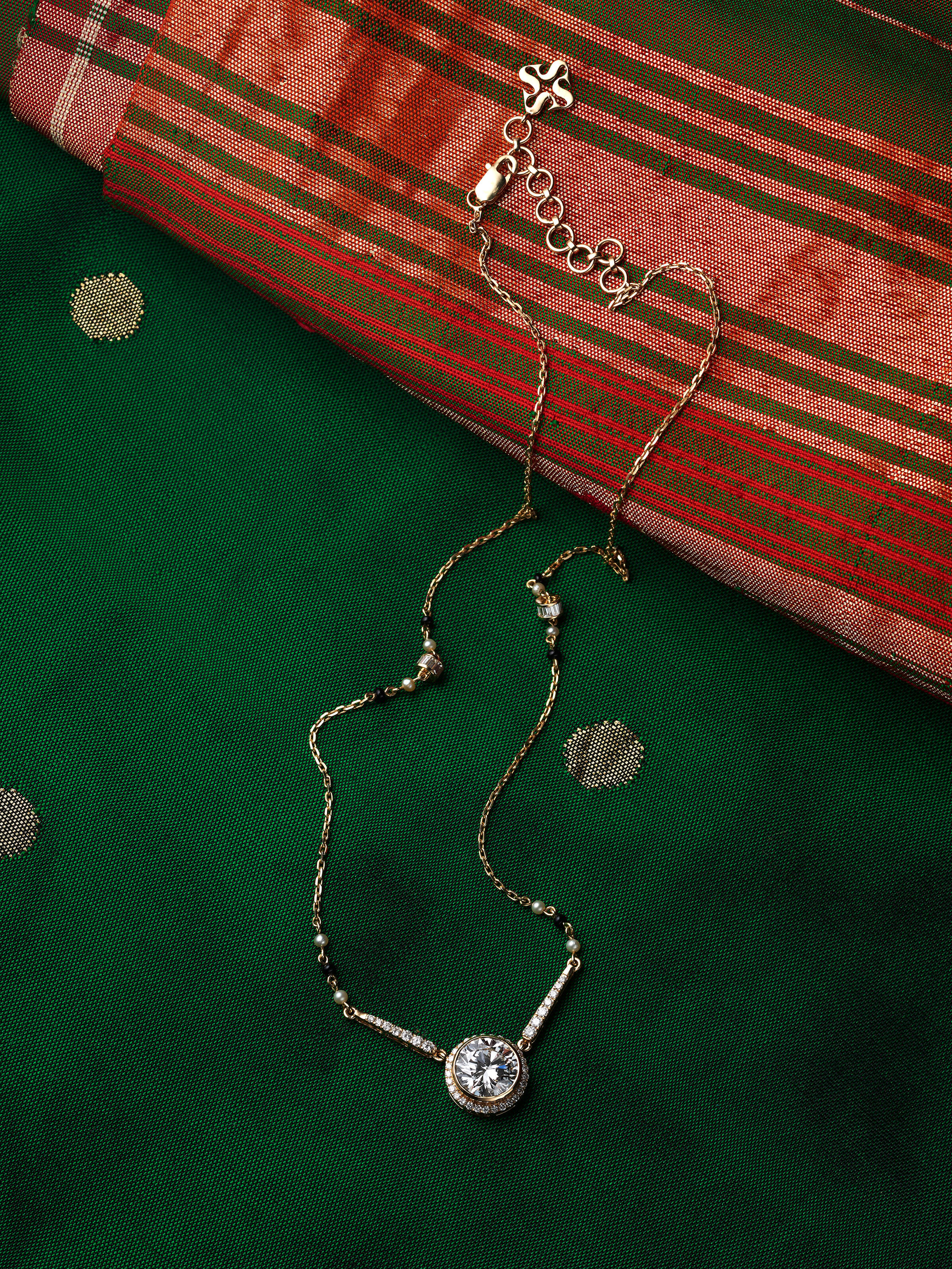 lifestyle view of open setting 14 karat gold mangalsutra