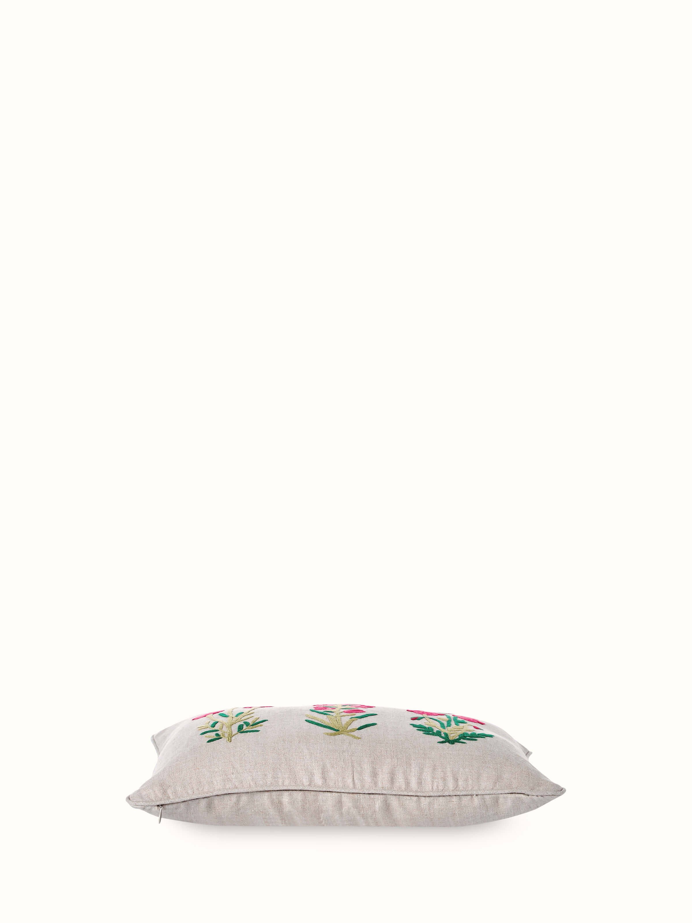 Angled shot emphasizing the texture and intricate hand embroidery details