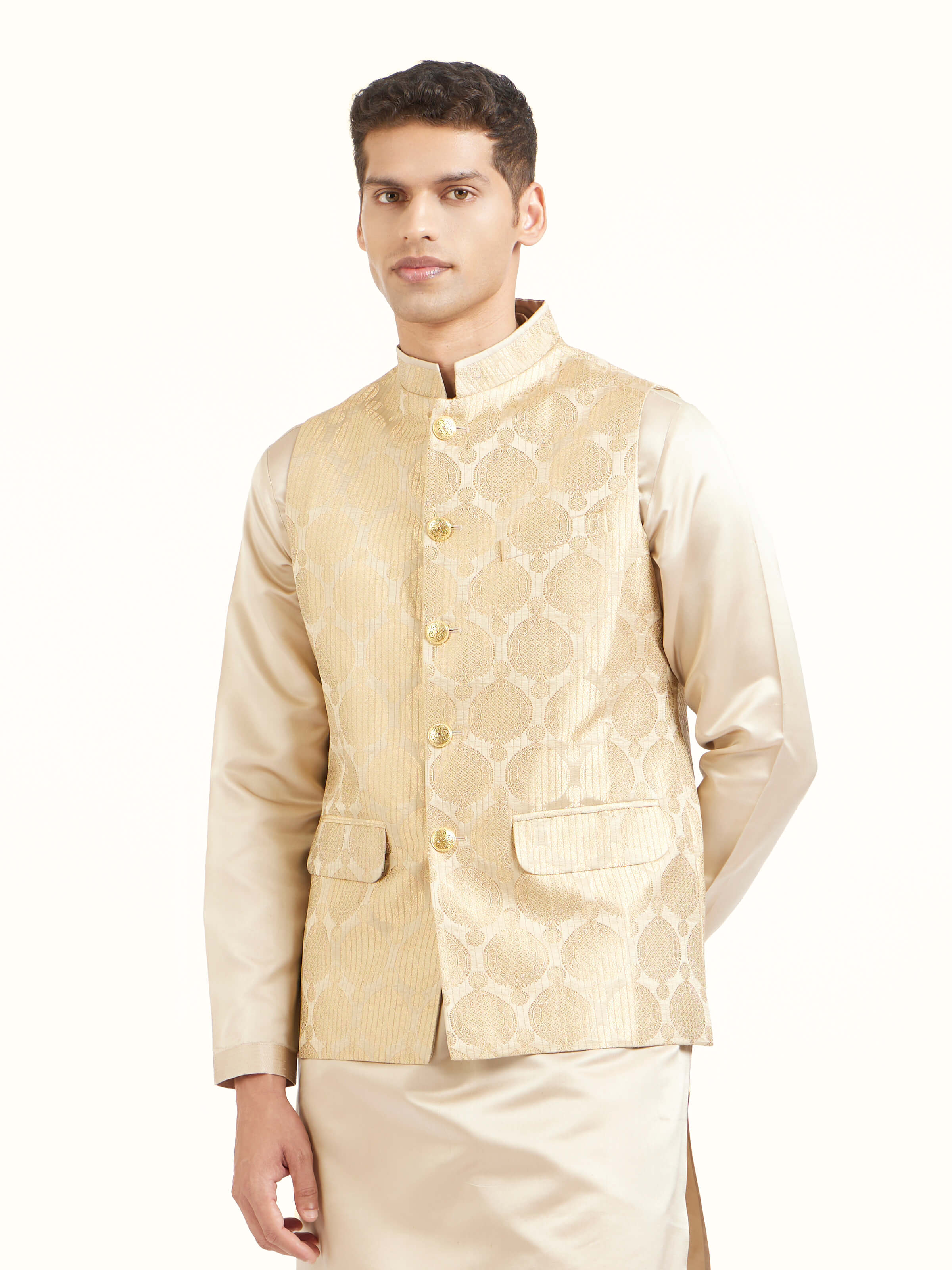 Angled view of beige silk Banarasi sleeveless jacket emphasizing Banarasi weave and sheen