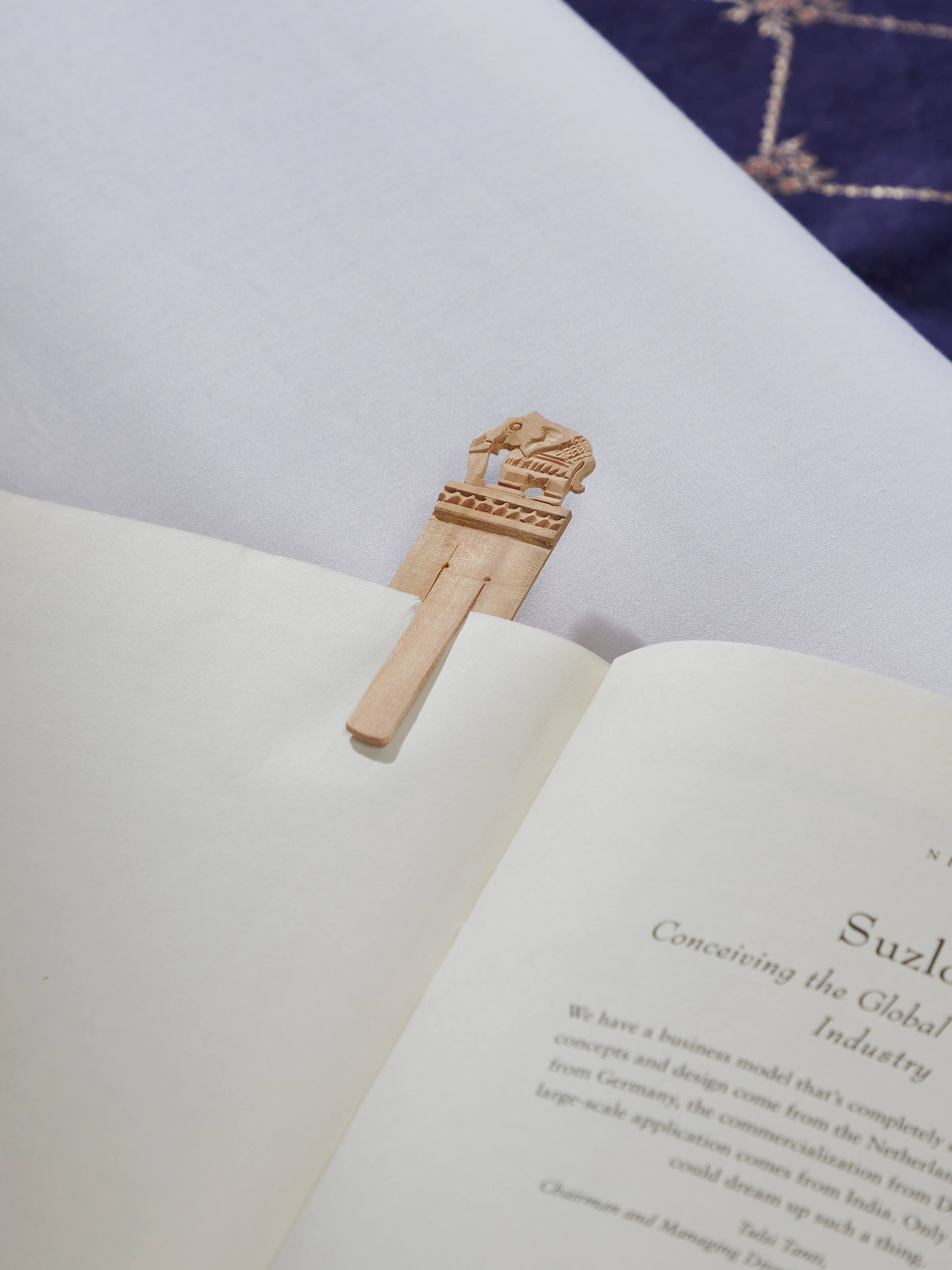 Side view of Carved Sandalwood Bookmark highlighting intricate design and fine craftsmanship.