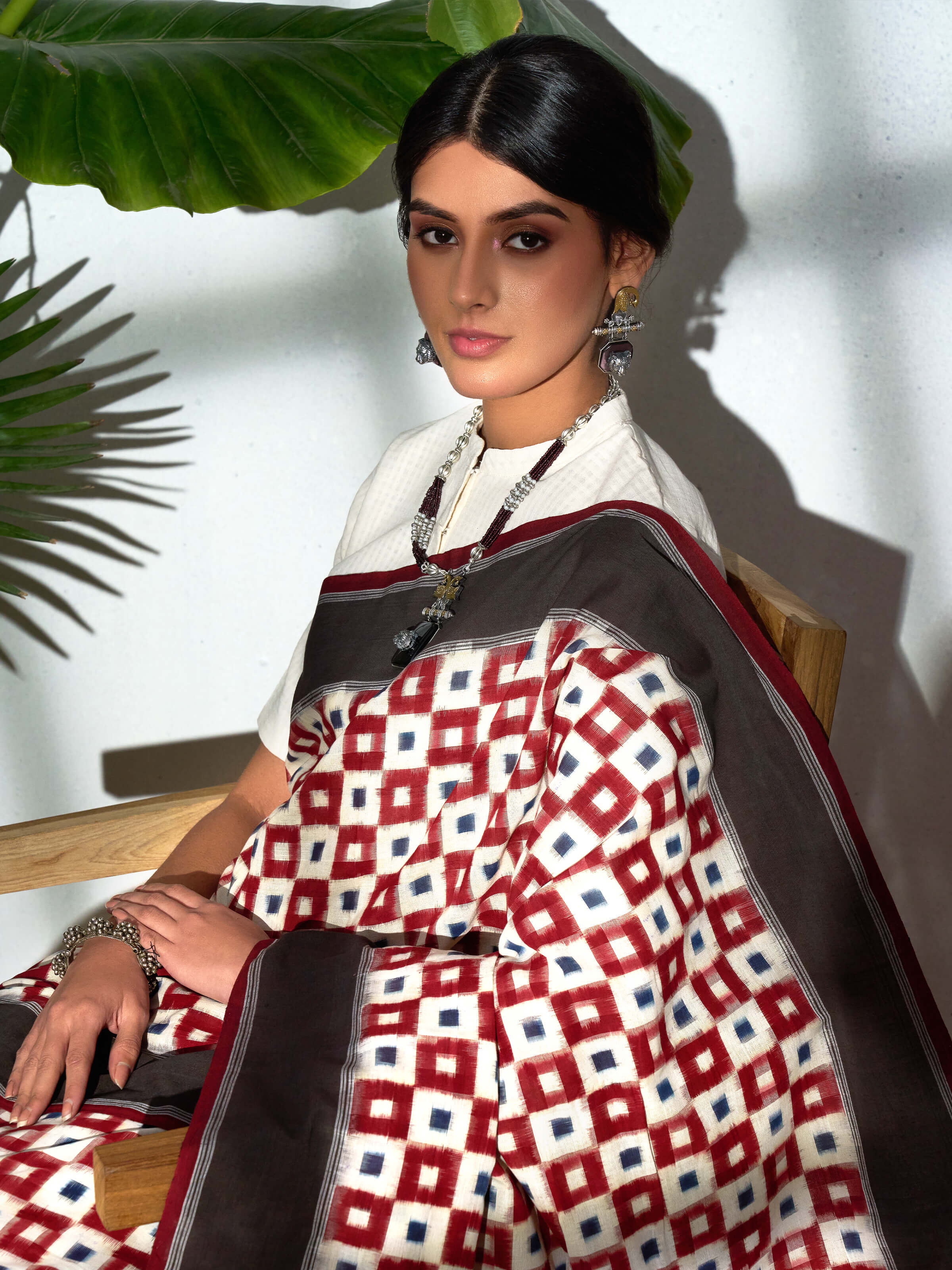 Detail view of brown cotton double ikat saree showing fabric texture
