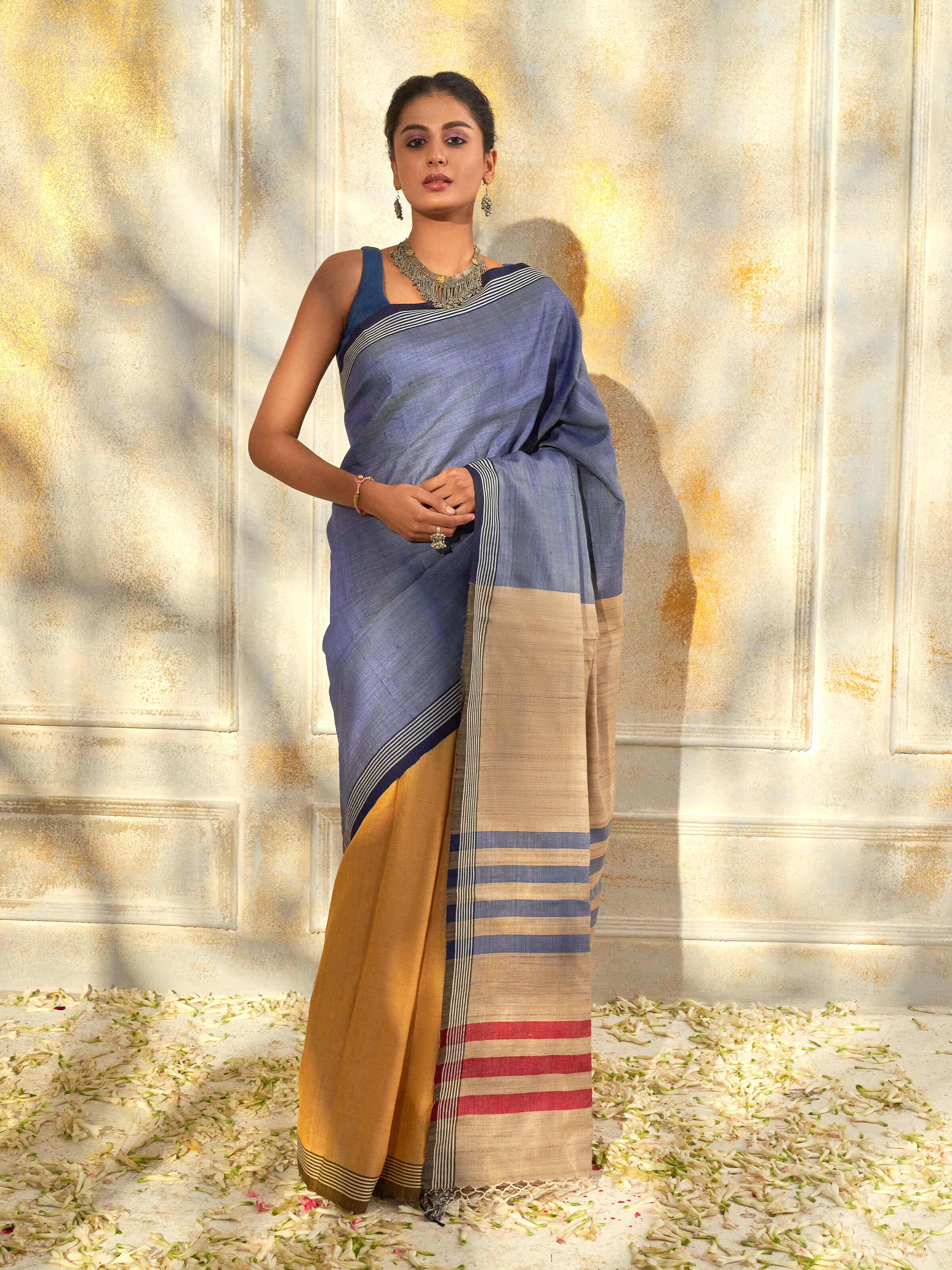 Side view of blue tussar silk Bhagalpur saree with elegant drape