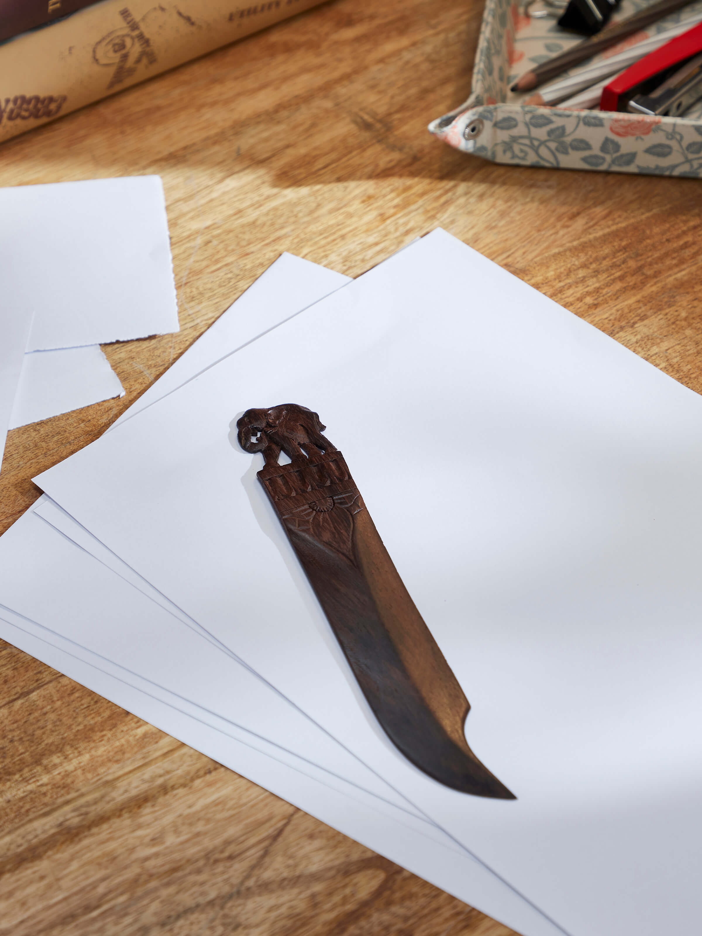 Lifestyle view of Carved Rosewood Elephant Paper Cutter