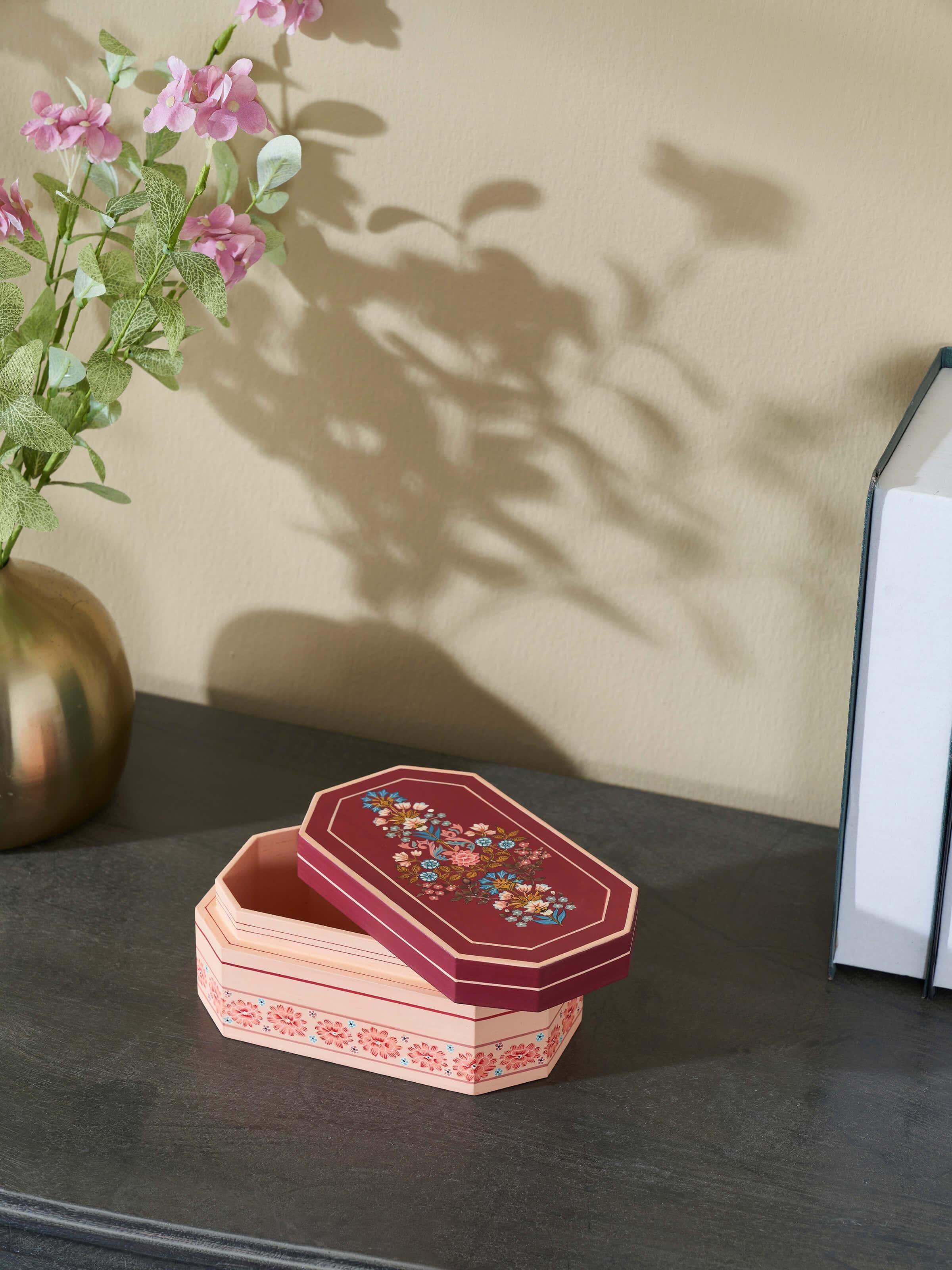Close-up view of the marquetry papier-mache and wood decorative container, highlighting the detailed craftsmanship.