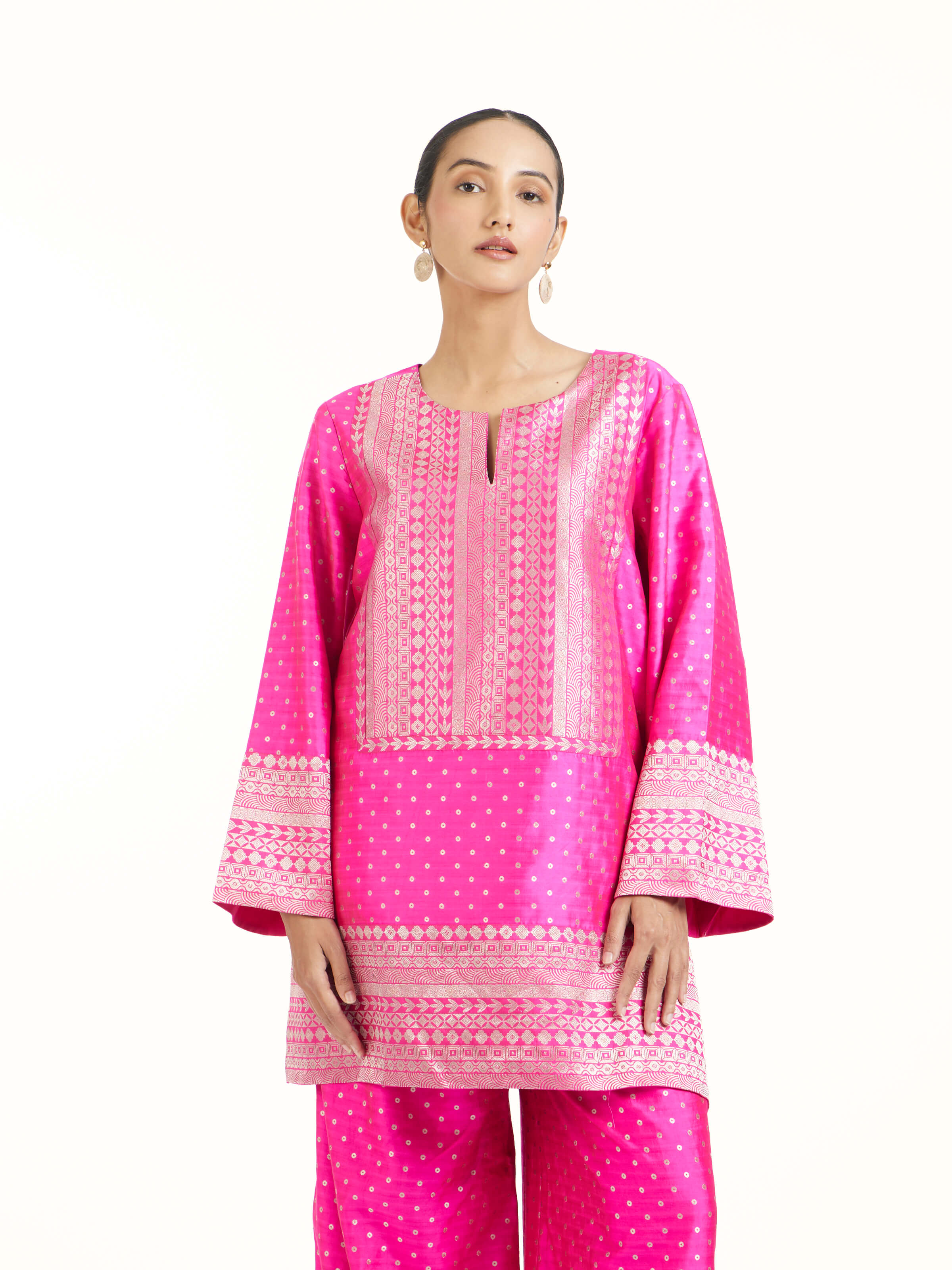 Angled view of pink silk Banarasi co-ord set emphasizing Banarasi weave