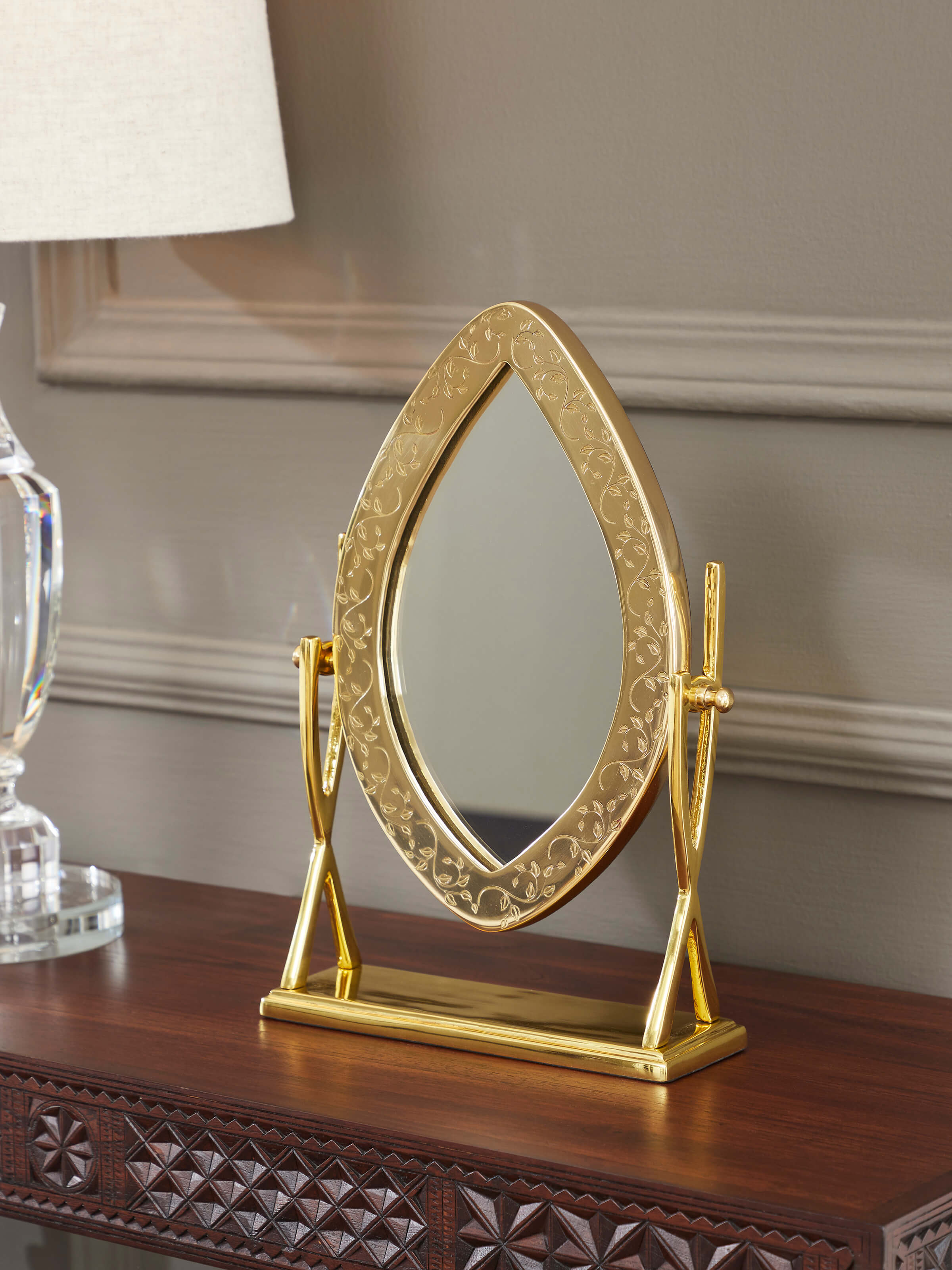 Side view of Natural Brass Table Mirror from Swadesh, showcasing the fine details of its polished brass frame.