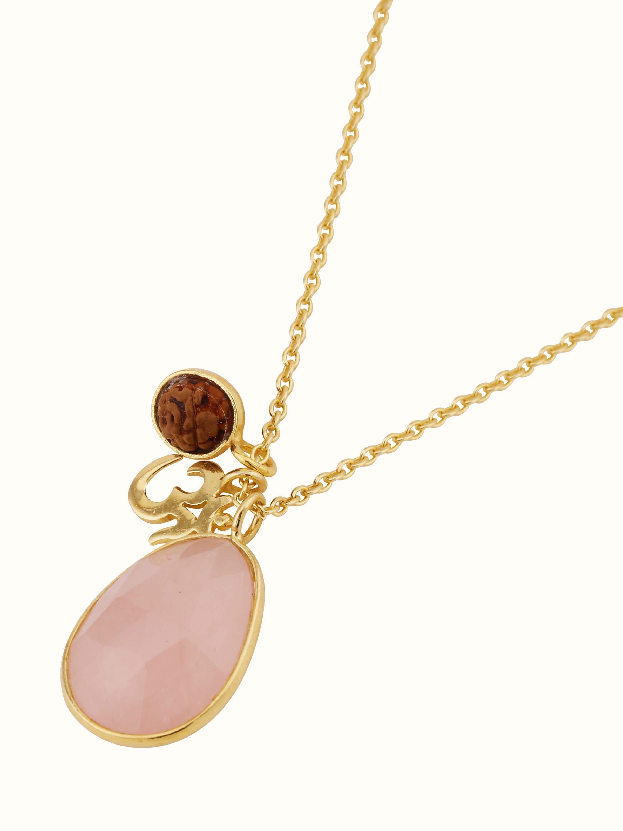 Top view of Rudraksha, Om Charm & Rose Quartz Necklace highlighting the balance of charm placement and overall design