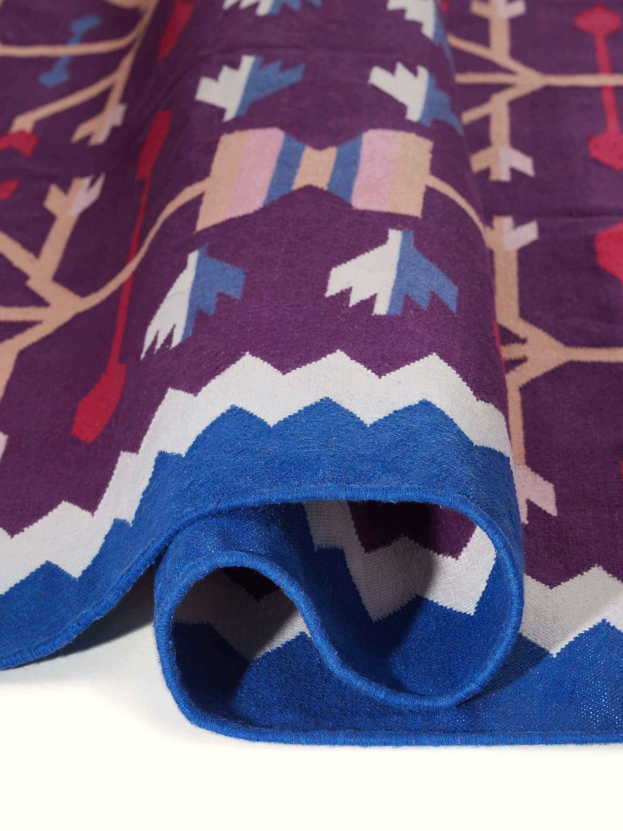 Detailed view focusing on the finishing and edge design of the dhurrie