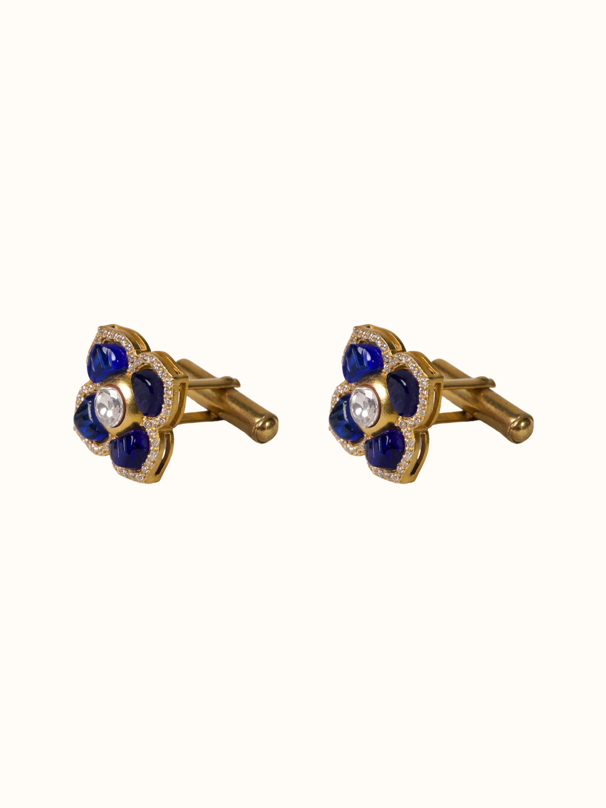 angled view of silver smithing gold plated cufflinks set