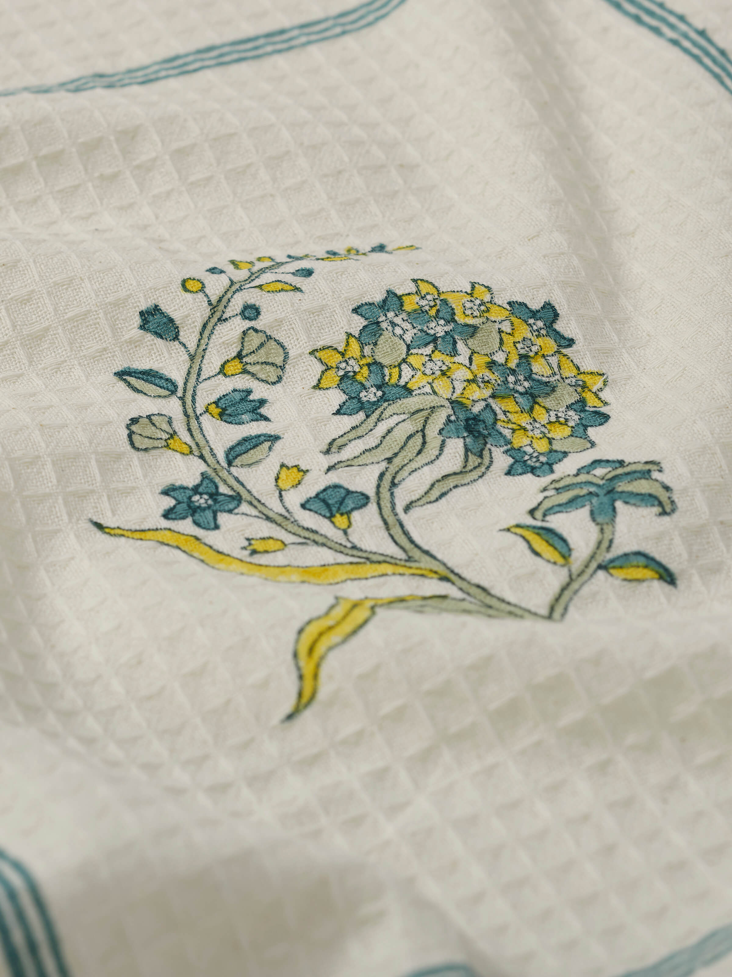 Angled view of Sanganeri Block Printed Towel with vibrant floral design and artisan texture.
