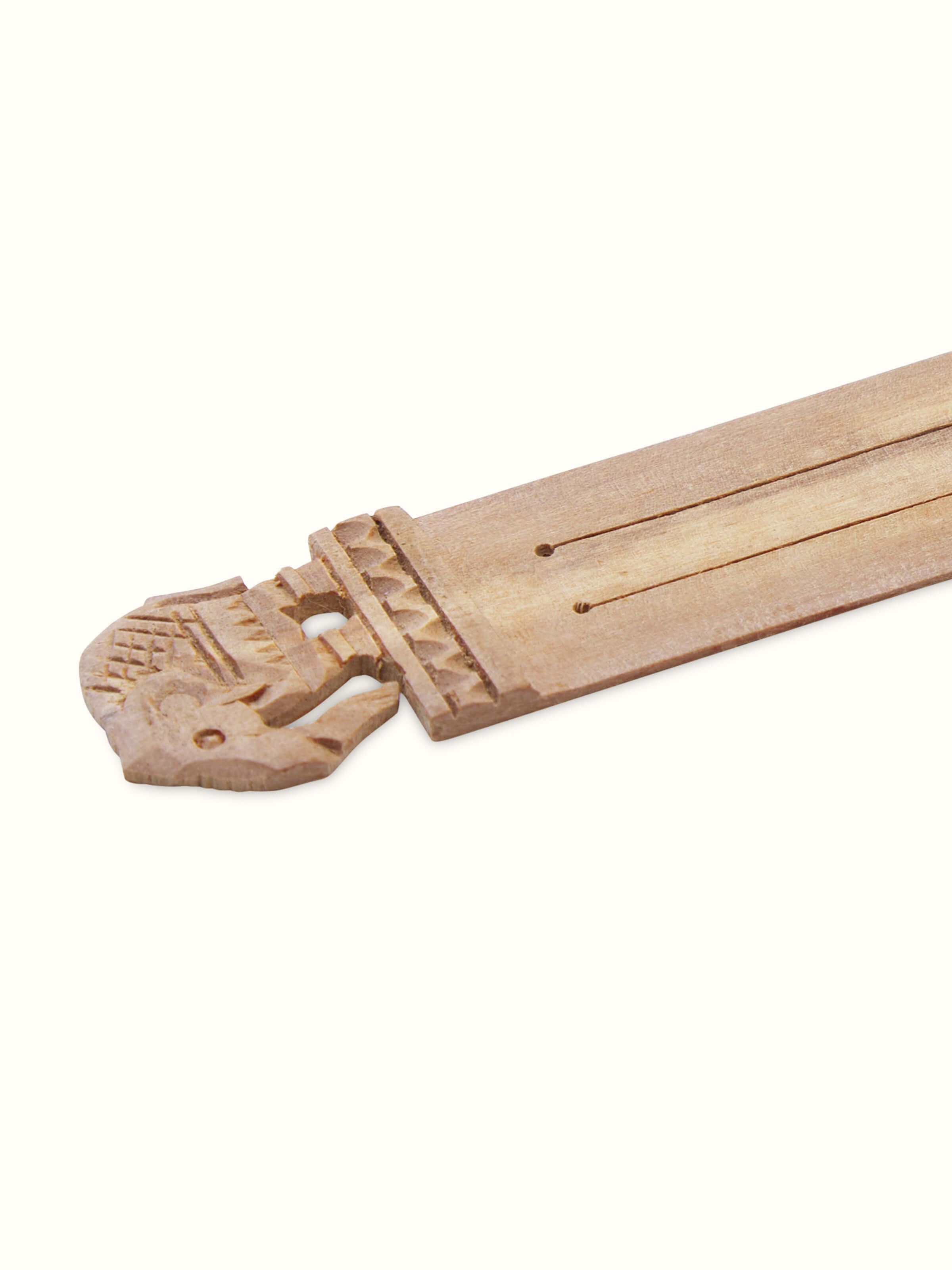 Detailed view of Carved Sandalwood Bookmark showcasing intricate carving and polished wood texture.