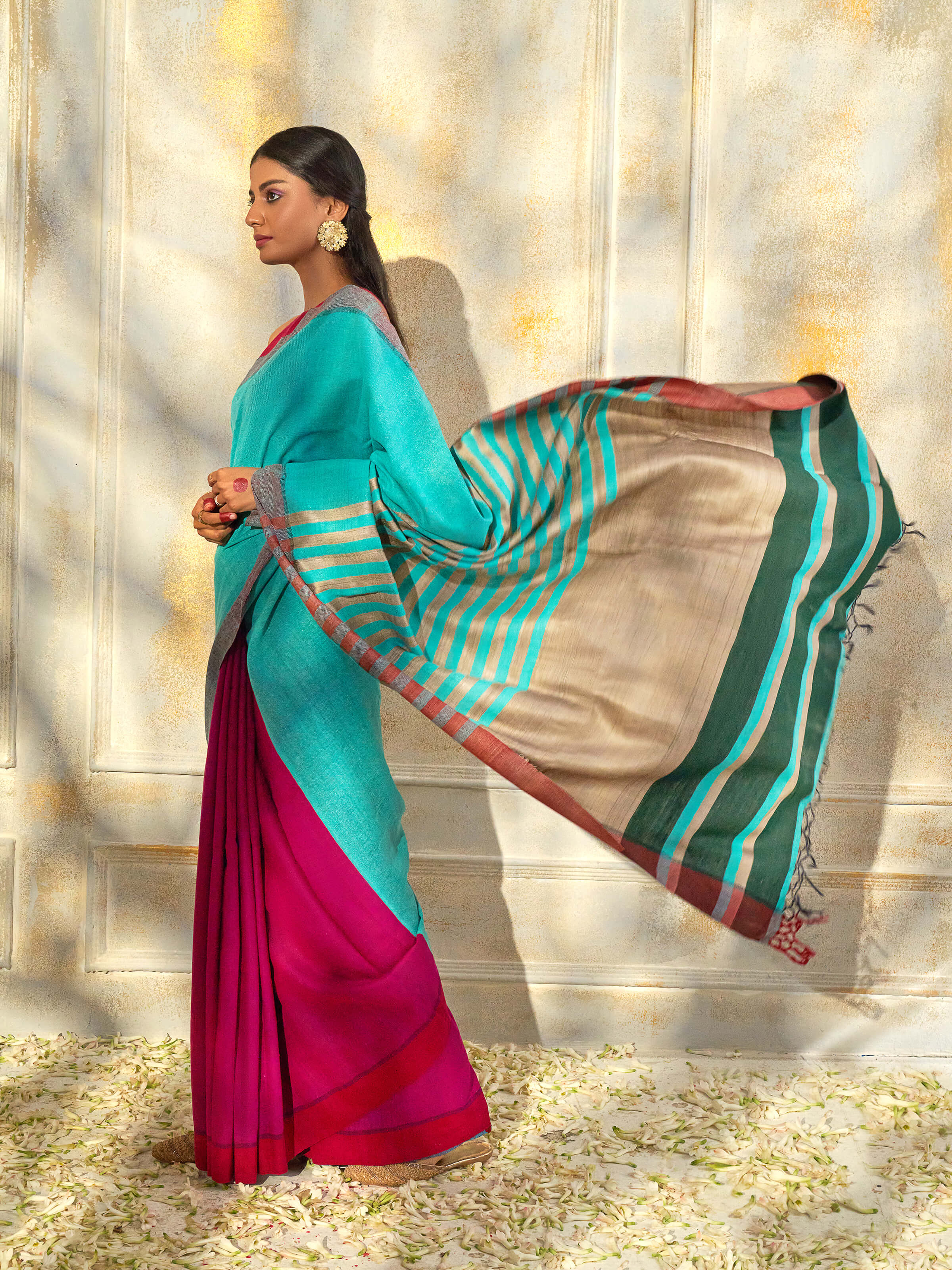 Angled view of turquoise tussar silk Bhagalpur saree highlighting woven texture