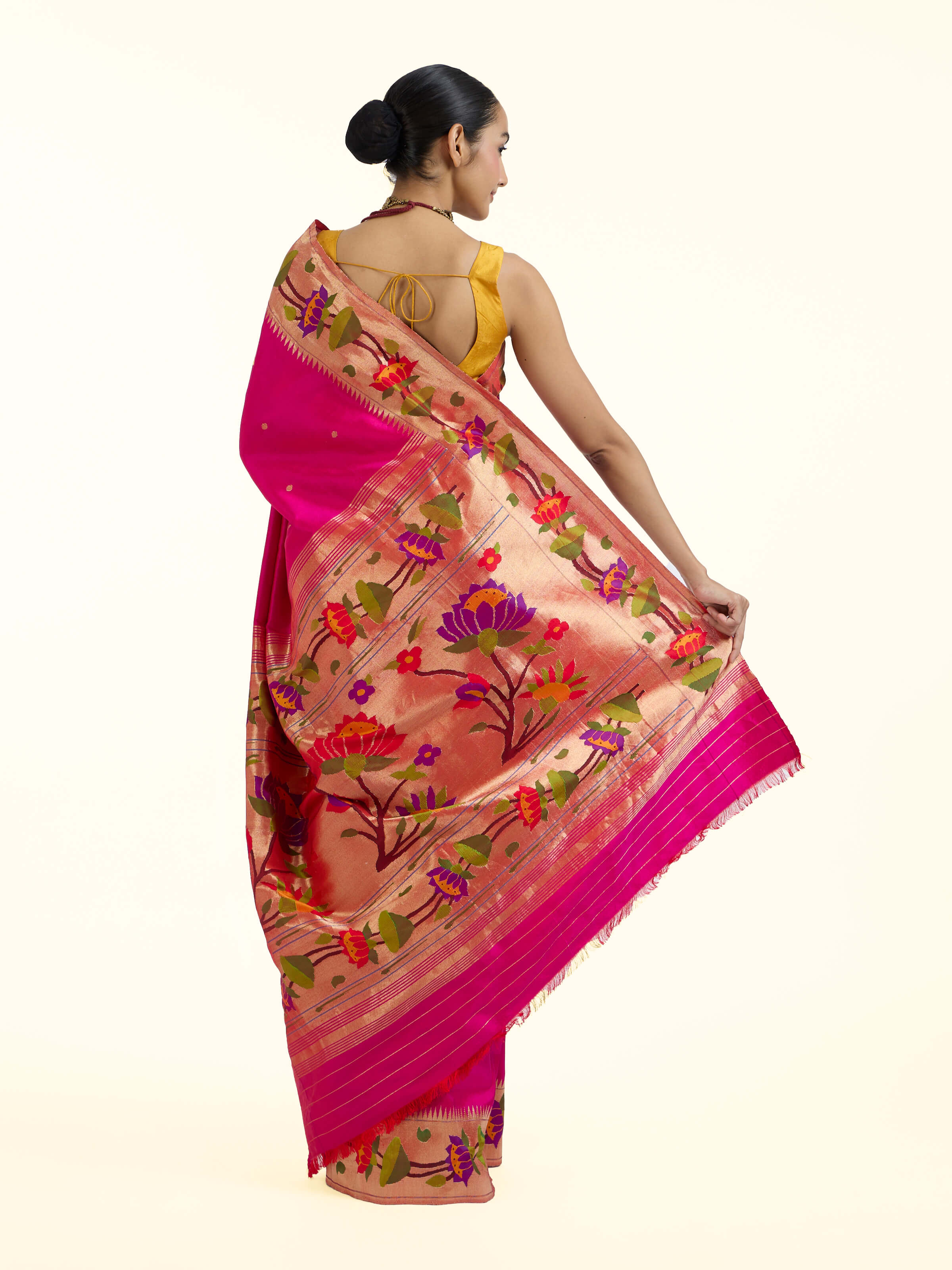 Back view of purple silk Paithani saree with richly designed pallu