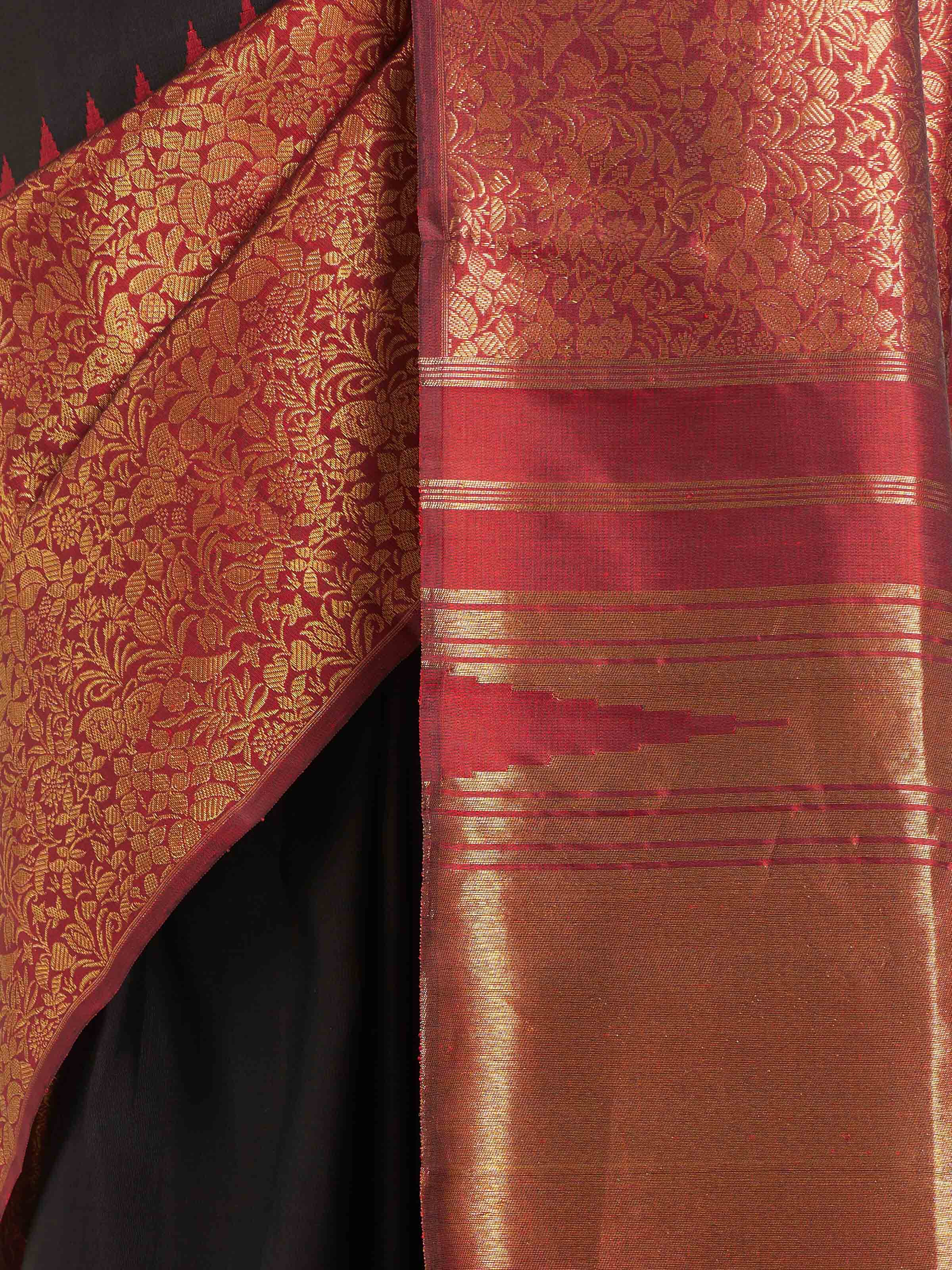 Detail view of black silk Kancheepuram saree showing silk texture and weaving details