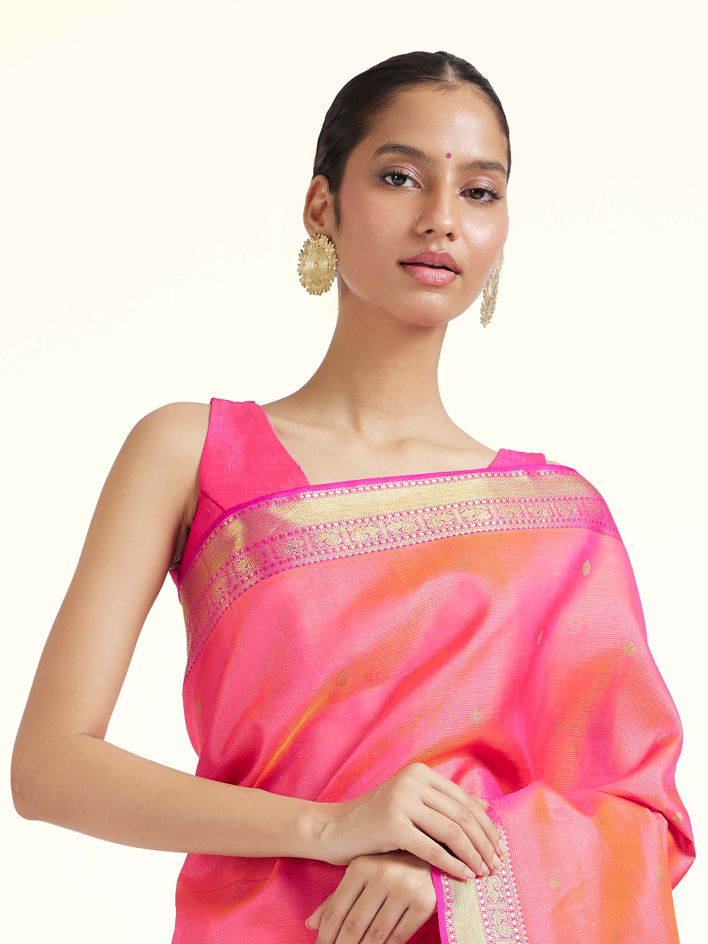 Angled view of pink silk Kancheepuram saree highlighting intricate zari craftsmanship