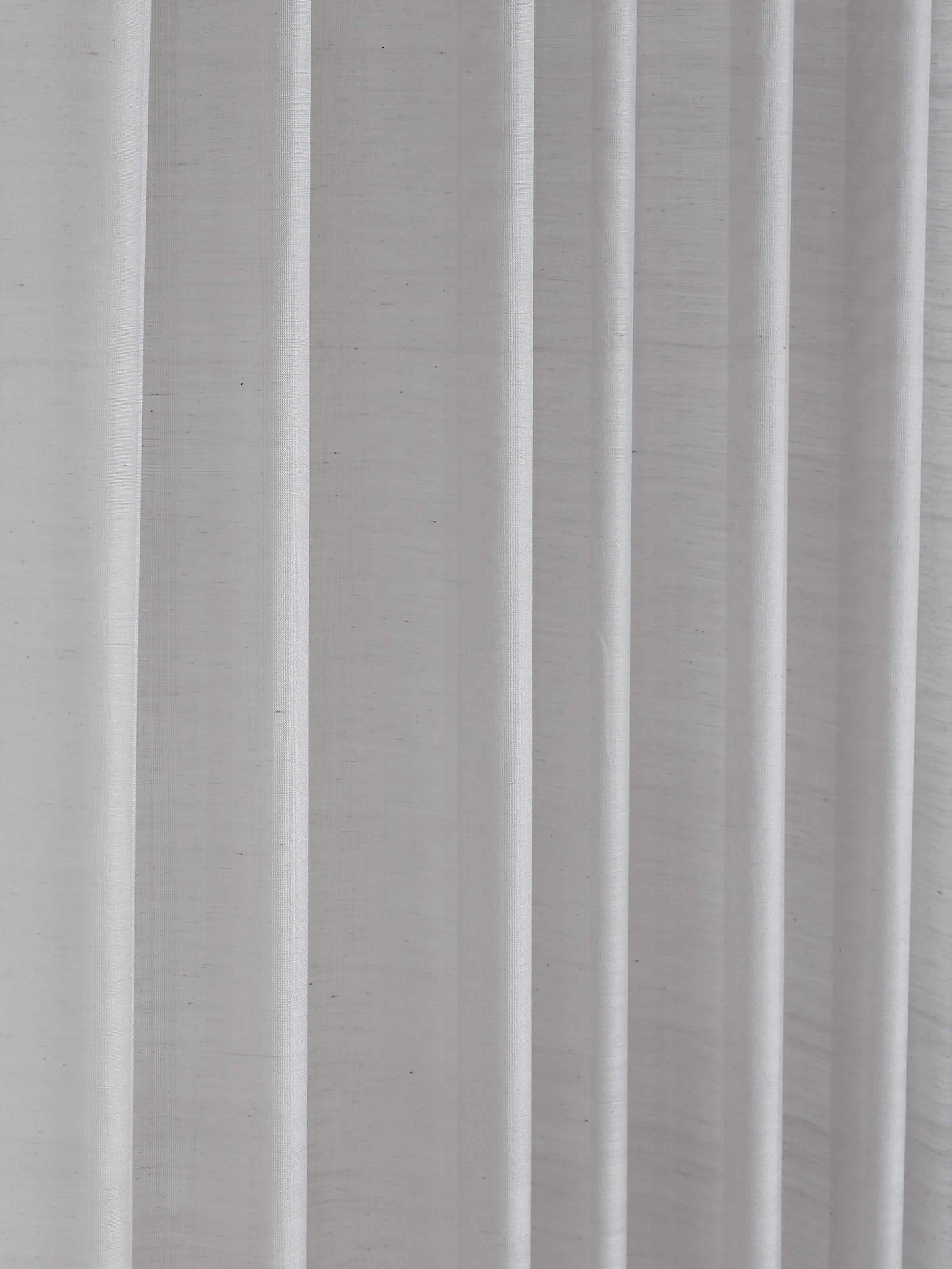 A side shot of the nine-foot Maheshwari handloom sheer curtain in grey stripe pattern, showing the transparency and soft fall of the fabric.