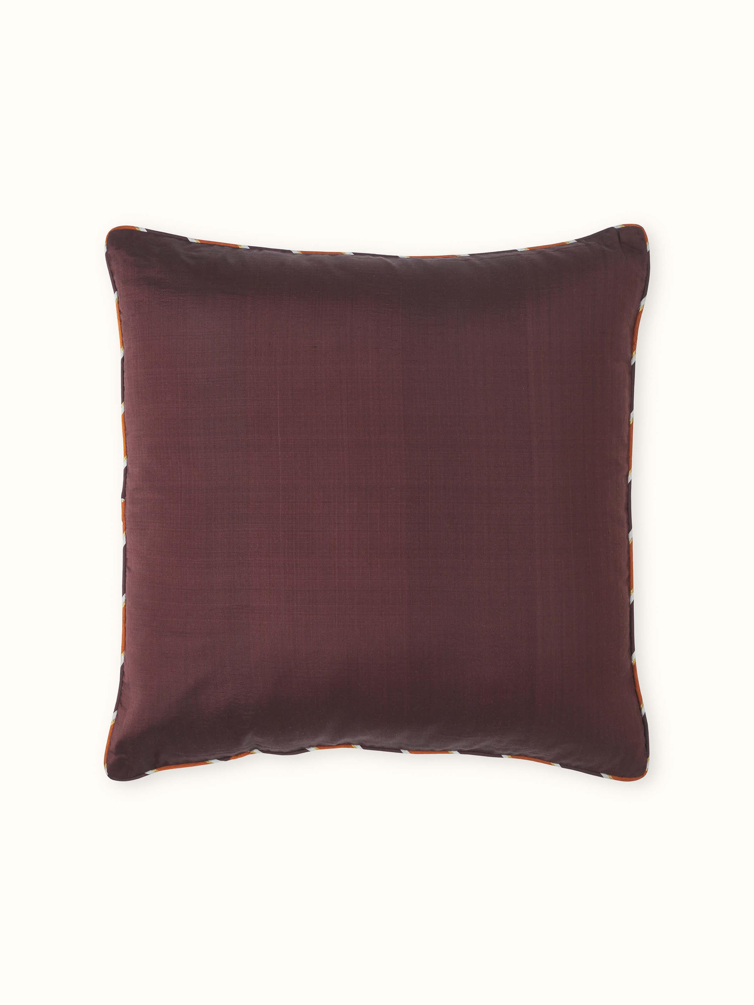 Front view of Bhoomi cushion cover in solid coffee brown silk with Odisha Ikat texture.