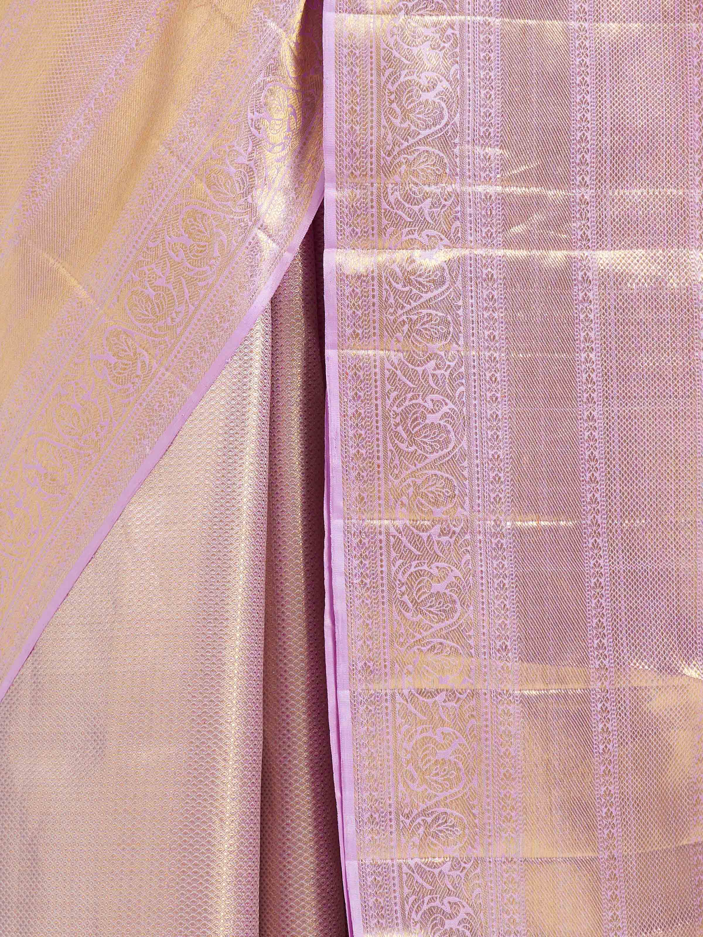 Detail view of beige silk Kancheepuram saree showing silk texture and zari craftsmanship