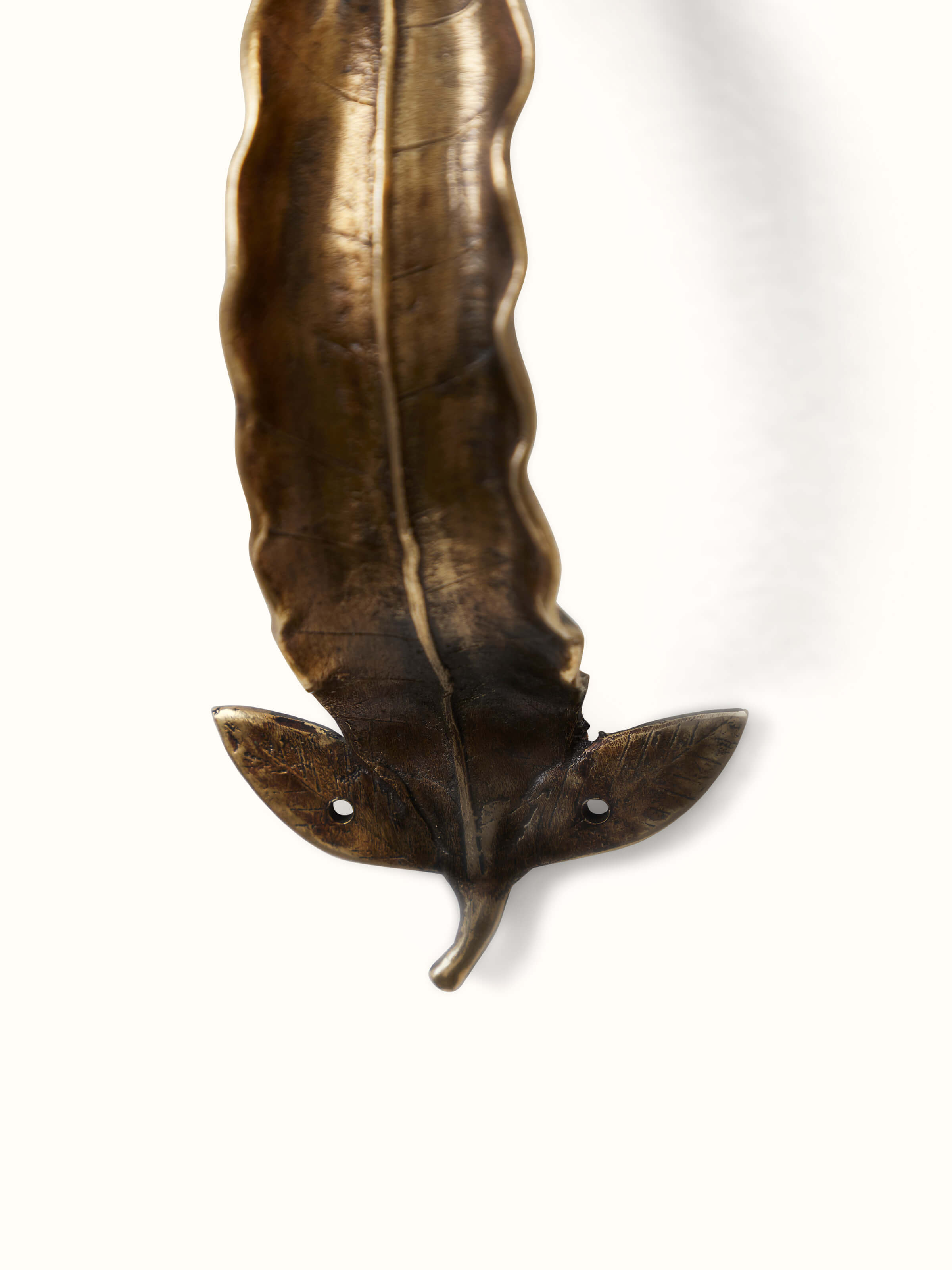 Artistic view of Swadesh Dhokra Brass Leaves Door Handle emphasizing the handcrafted brass texture and elegance.