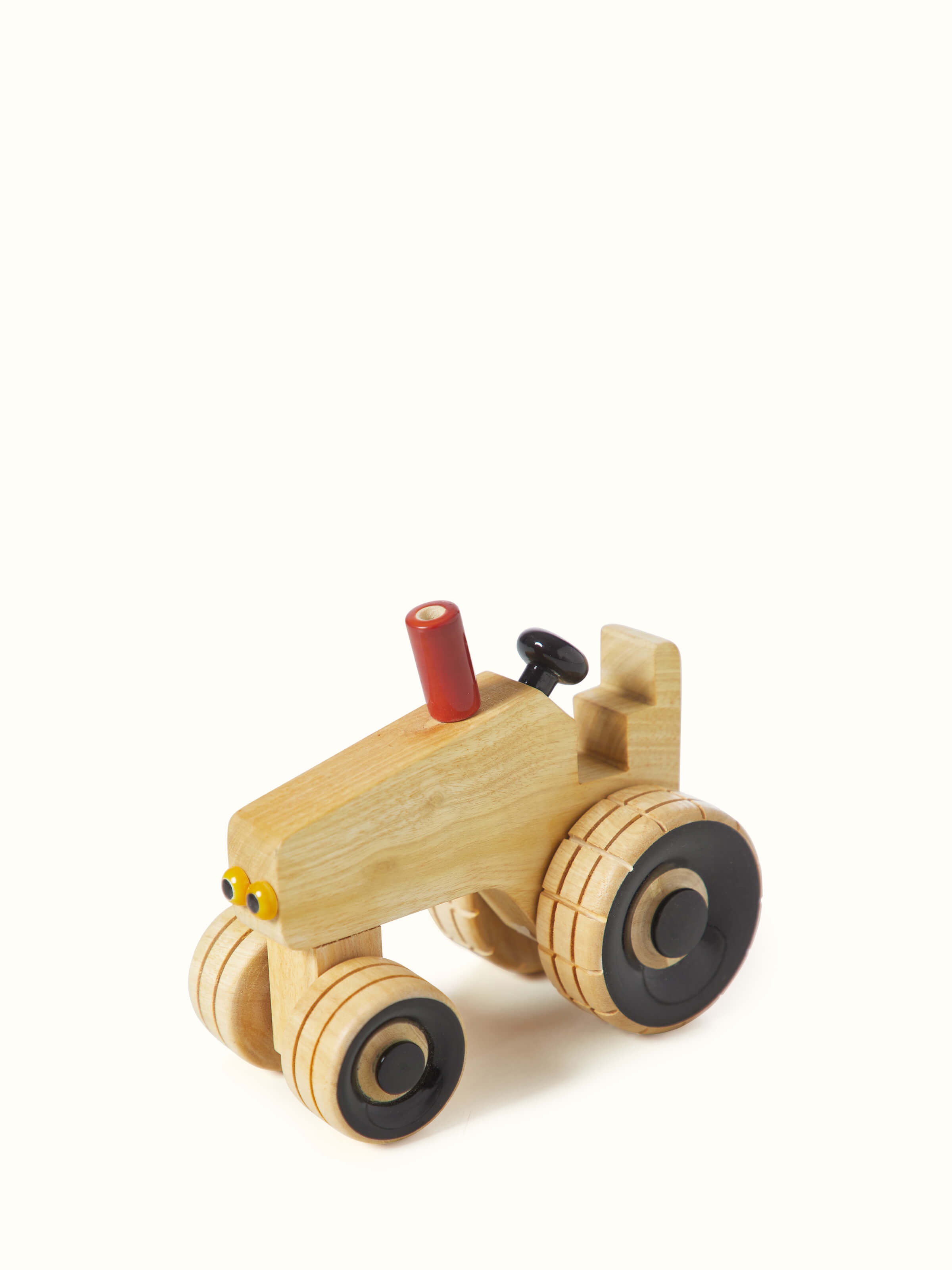 Top view of white Channapatna ivory wood tractor toy highlighting its detailed features