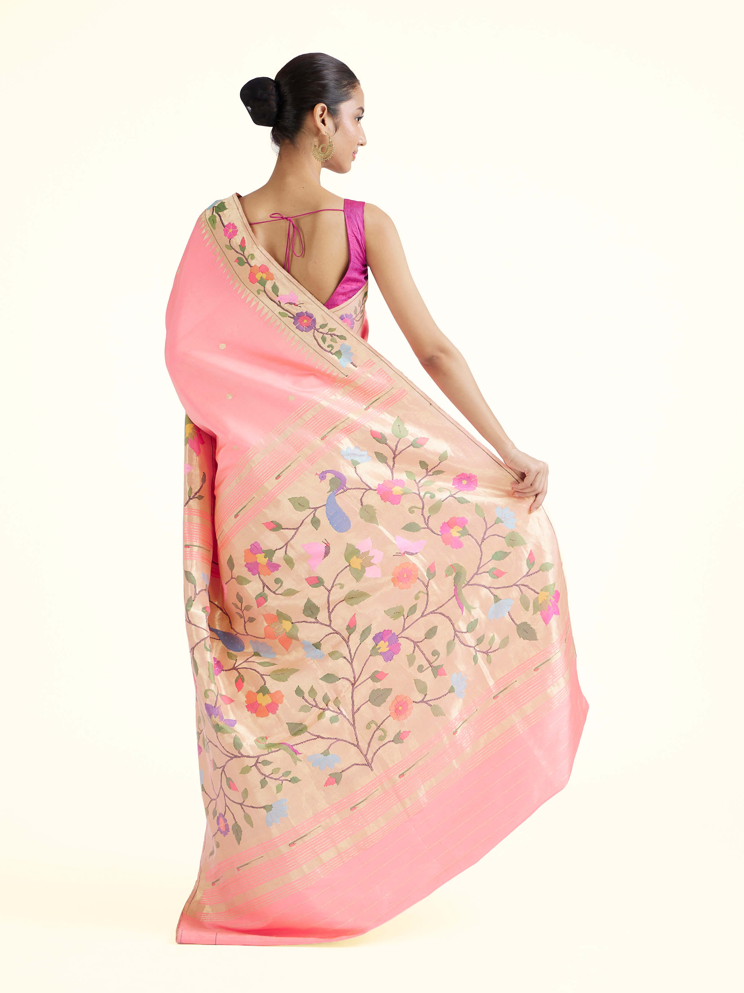 Back view of pink silk Paithani saree displaying ornate pallu