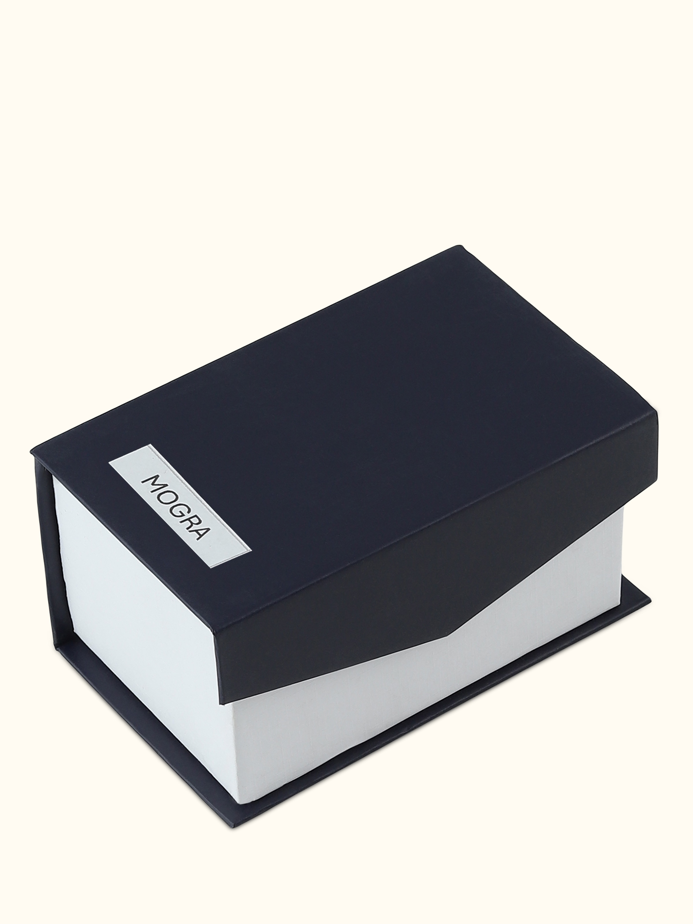 Overhead view of Attar Mogra attar, displaying the artisanal bottle and refined floral scent profile