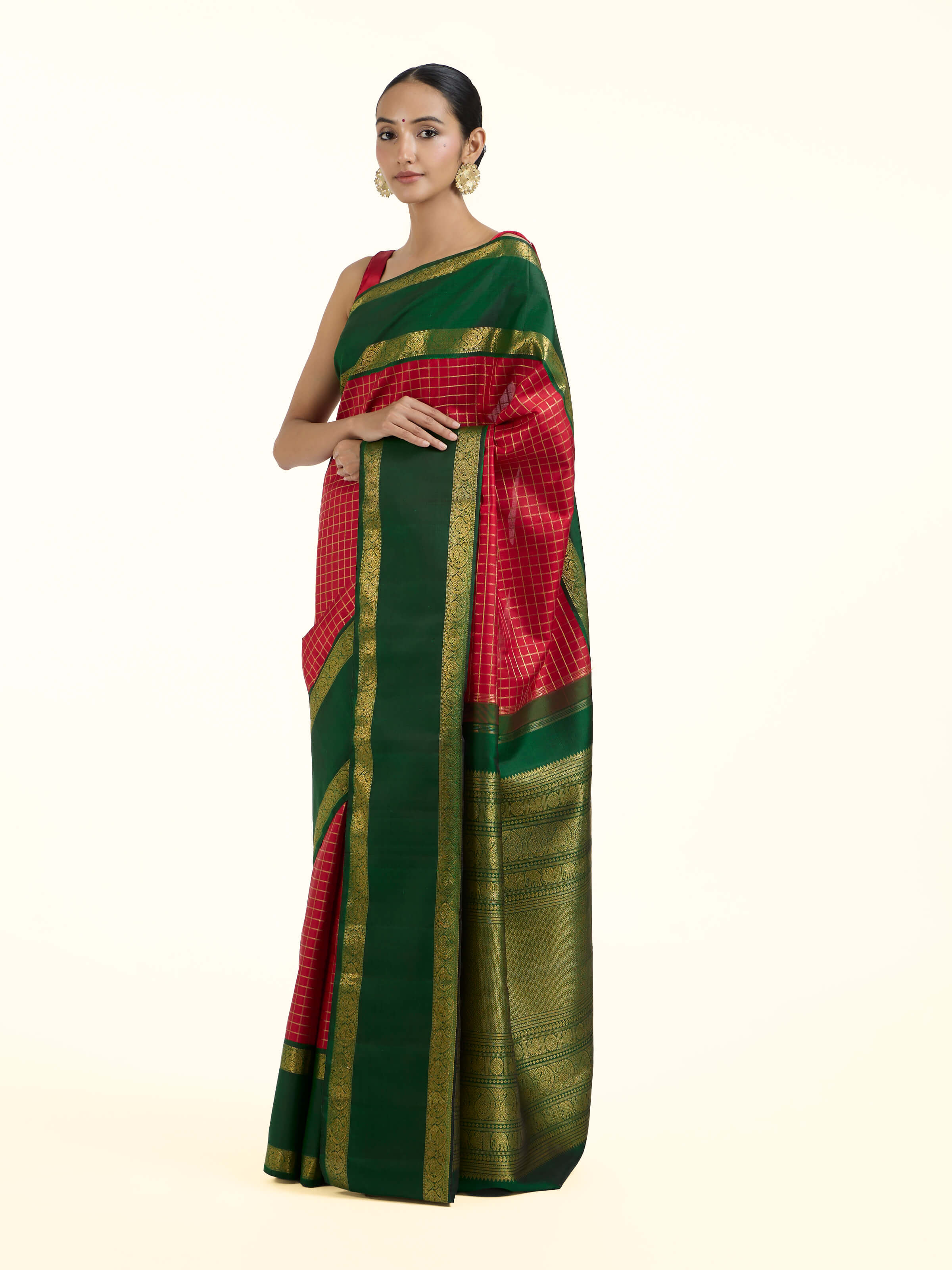 Side view of green silk Kancheepuram saree showcasing elegant drape