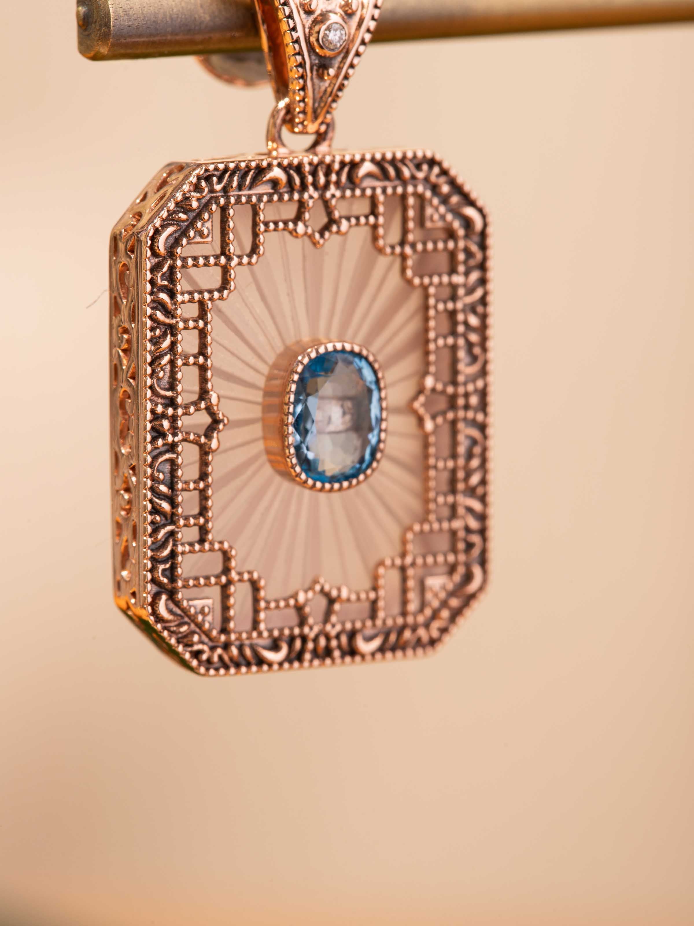 Detail shot of lapidary 14 karat gold drop earrings