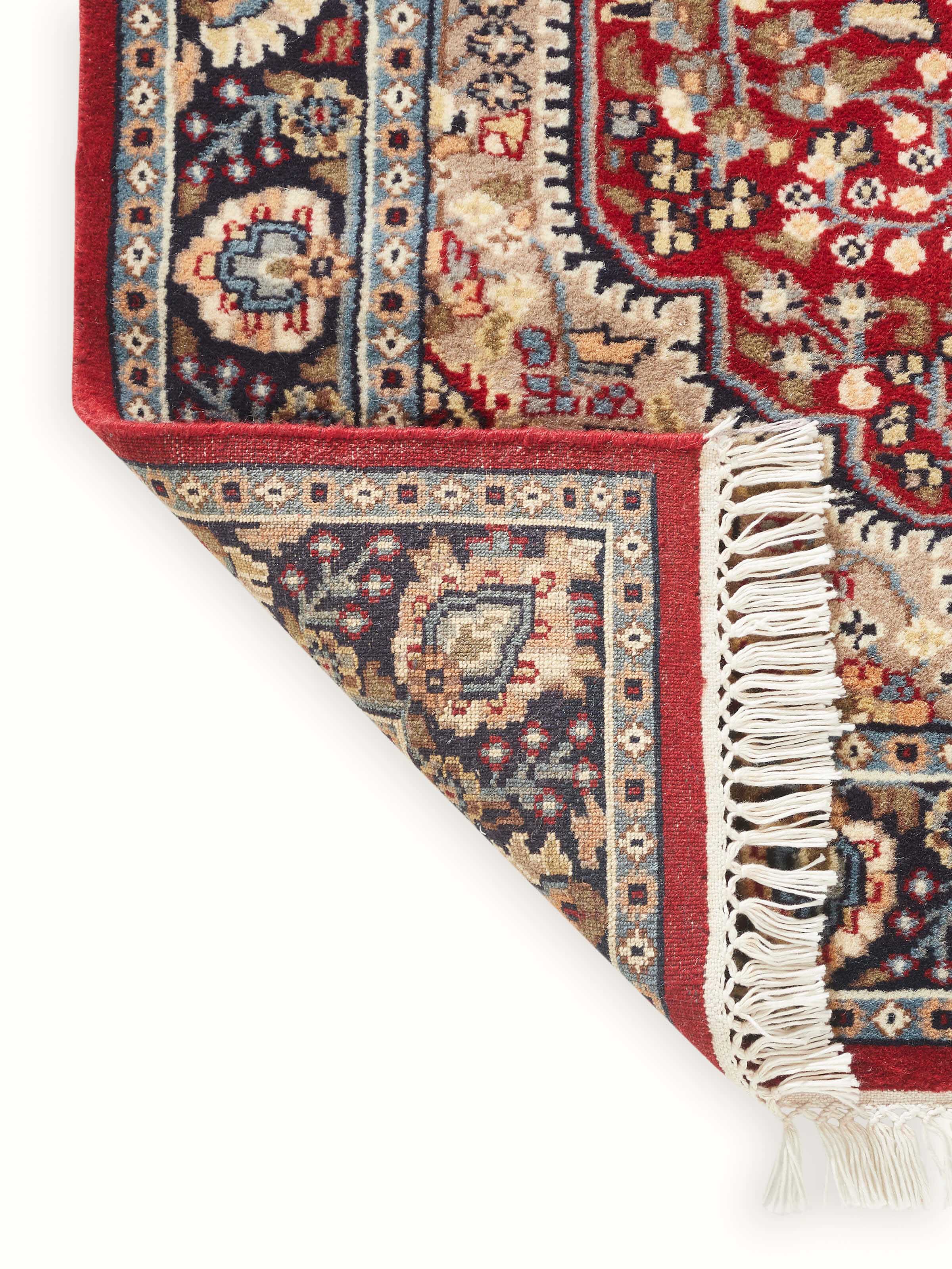 Back view displaying the hand-knotted underside and structural integrity of the carpet