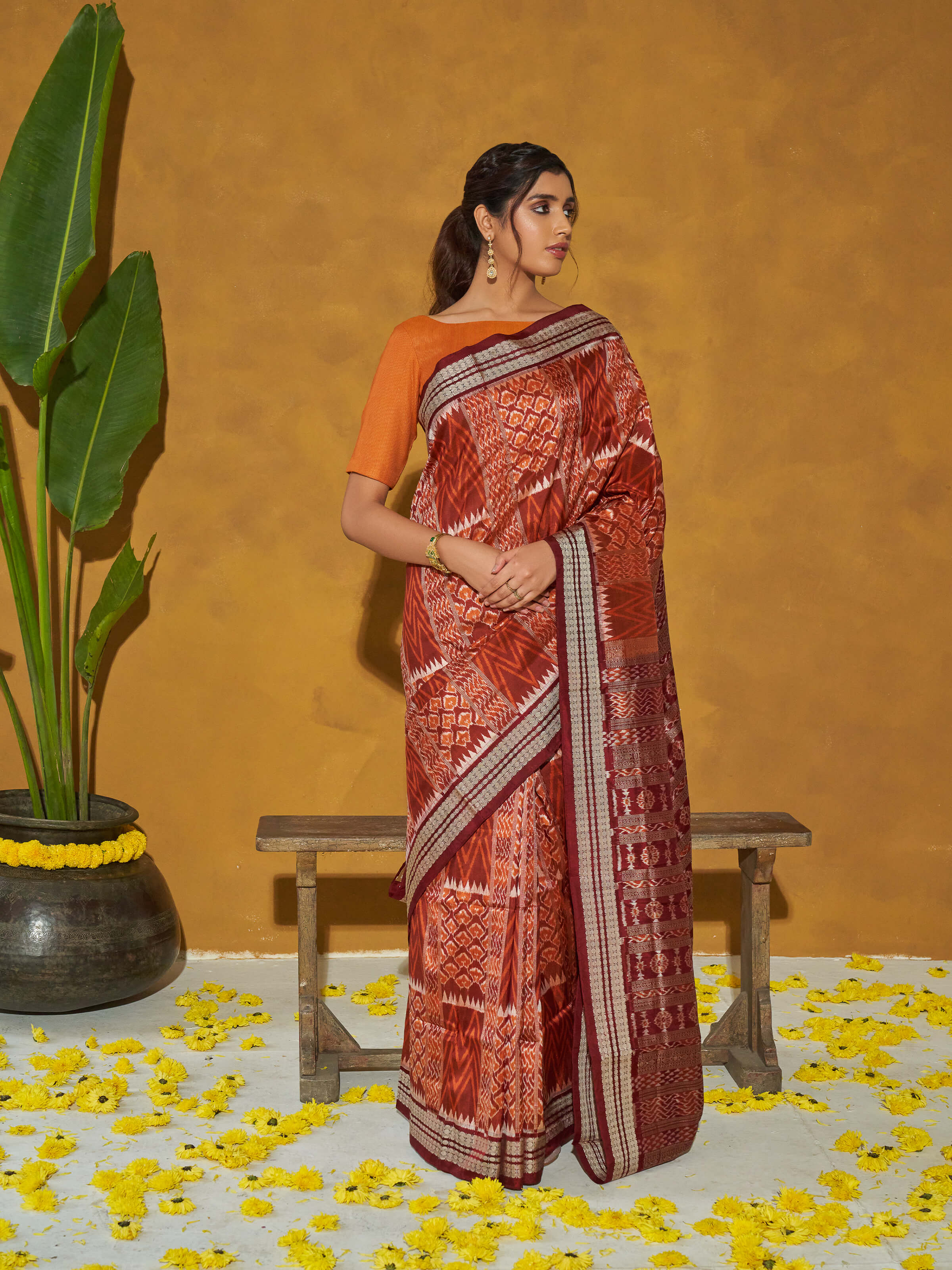 Side view of brown mulberry silk bandha Odisha saree showcasing weave texture