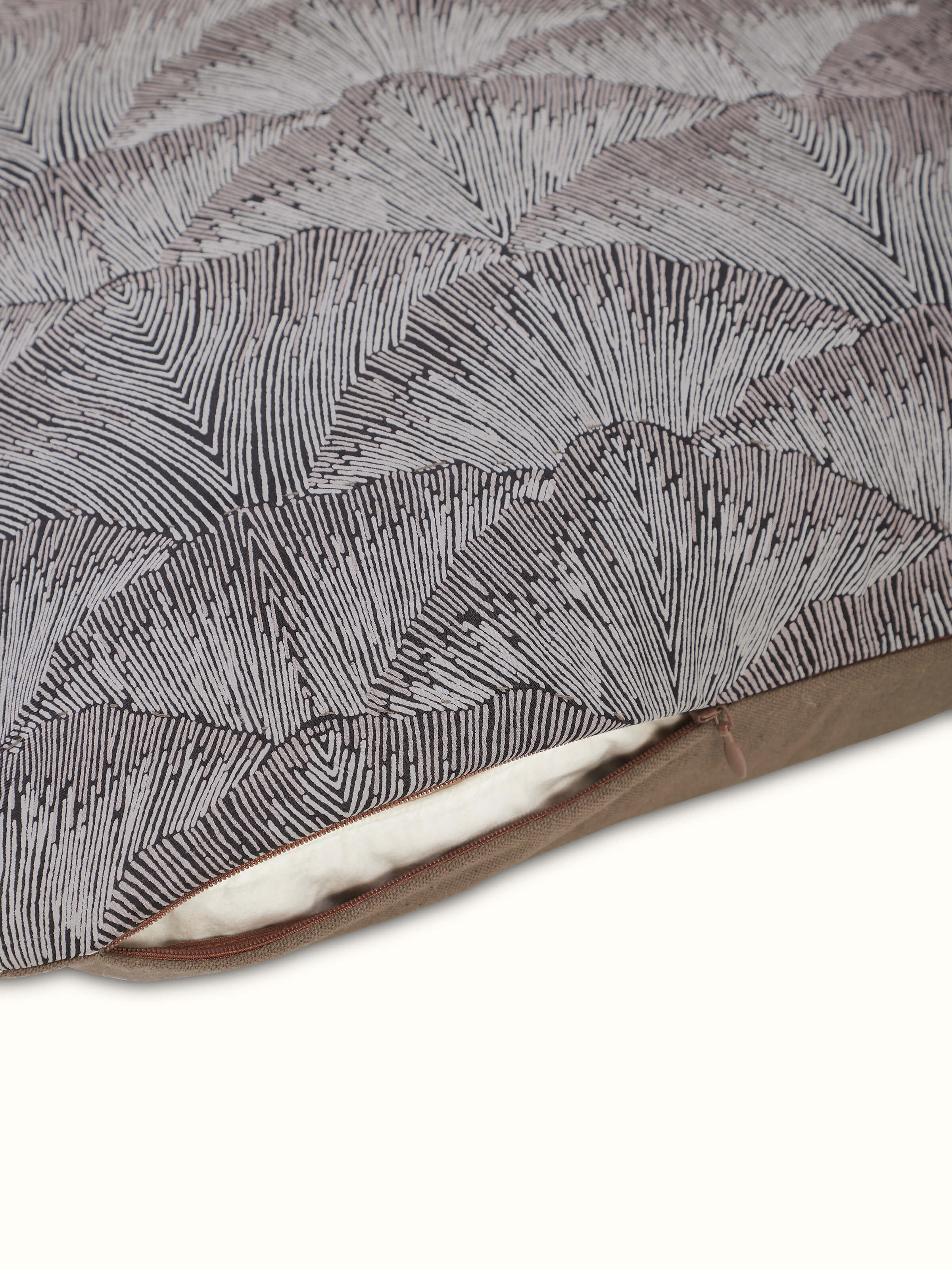 Detailed view of Parvat brown textured silk cushion cover with focus on silk sheen and block print alignment.