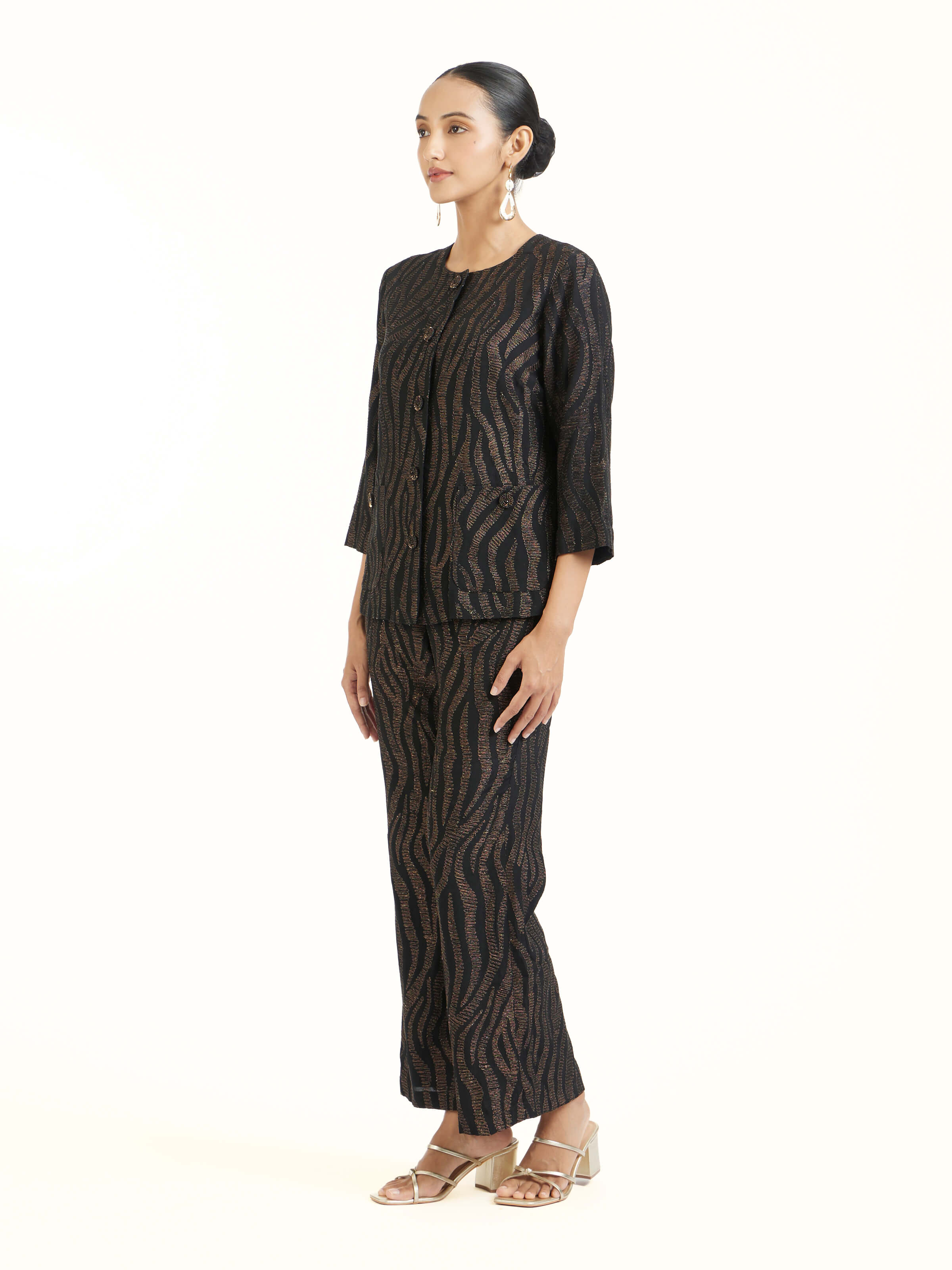 Side view of black aari hand embroidered jacket highlighting tailored silhouette