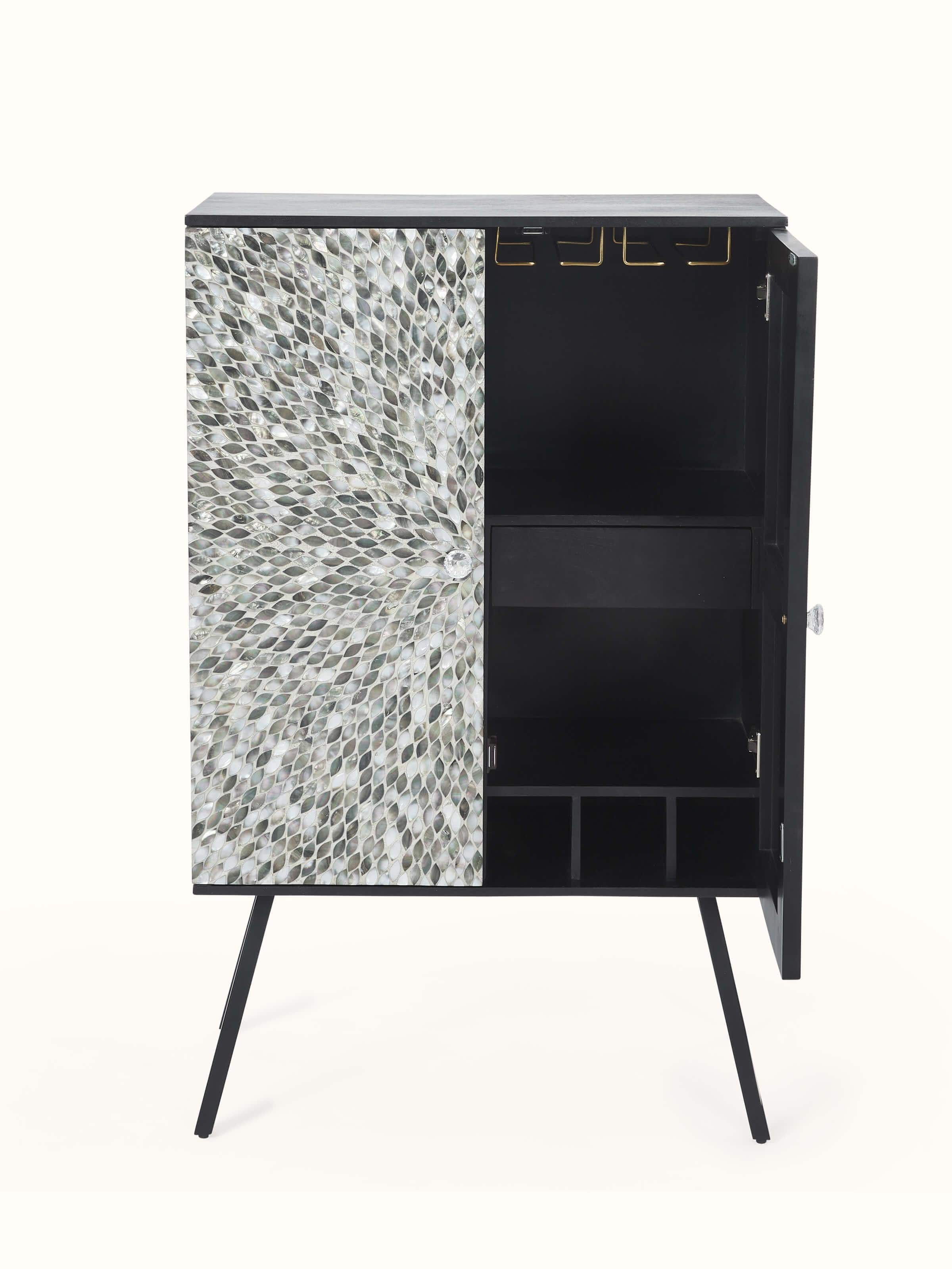 Close-up view of the mother-of-pearl inlay details on the mango wood bar cabinet, focusing on the delicate patterns and design