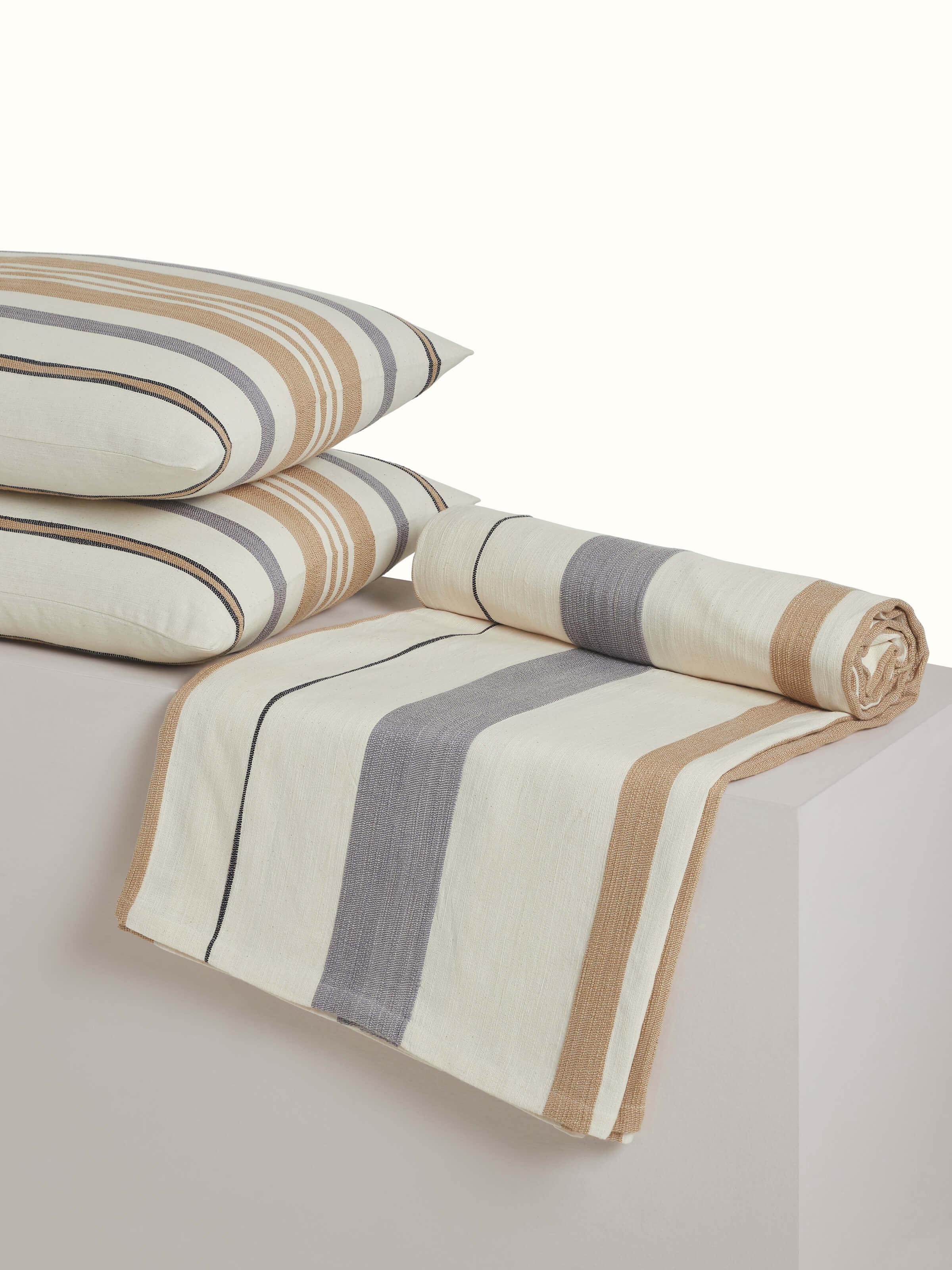 Angled view of Neerja Beige Stripe Cotton Bedspread Set, highlighting the fabric texture and stitching finish.