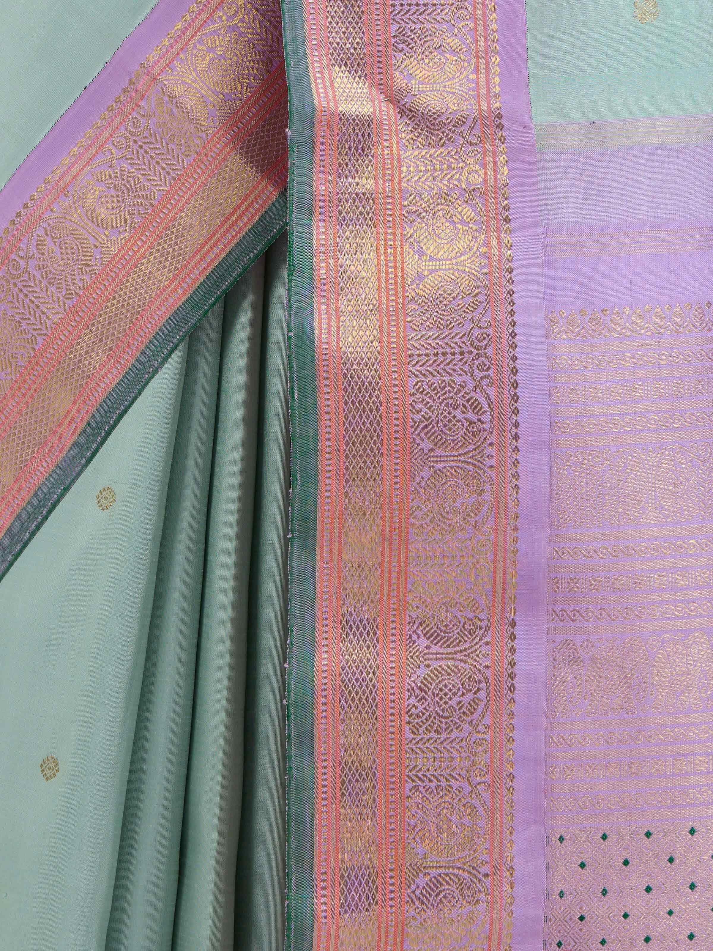 Detail view of light blue silk Kancheepuram saree showing silk texture and zari craftsmanship