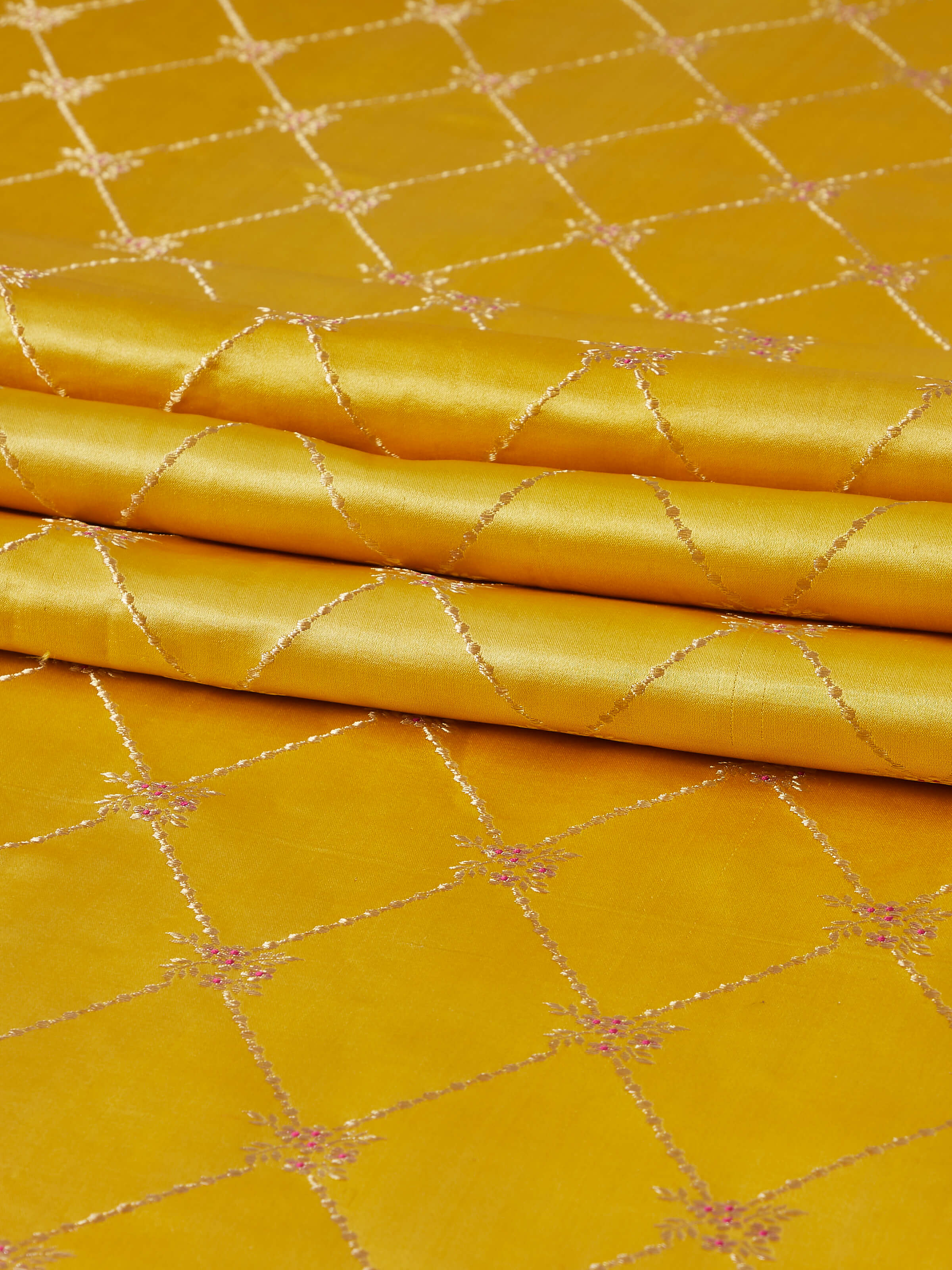 Close-up view of Awadh Yellow Banarasi Handloom Silk Bed Runner, focusing on its delicate weave.