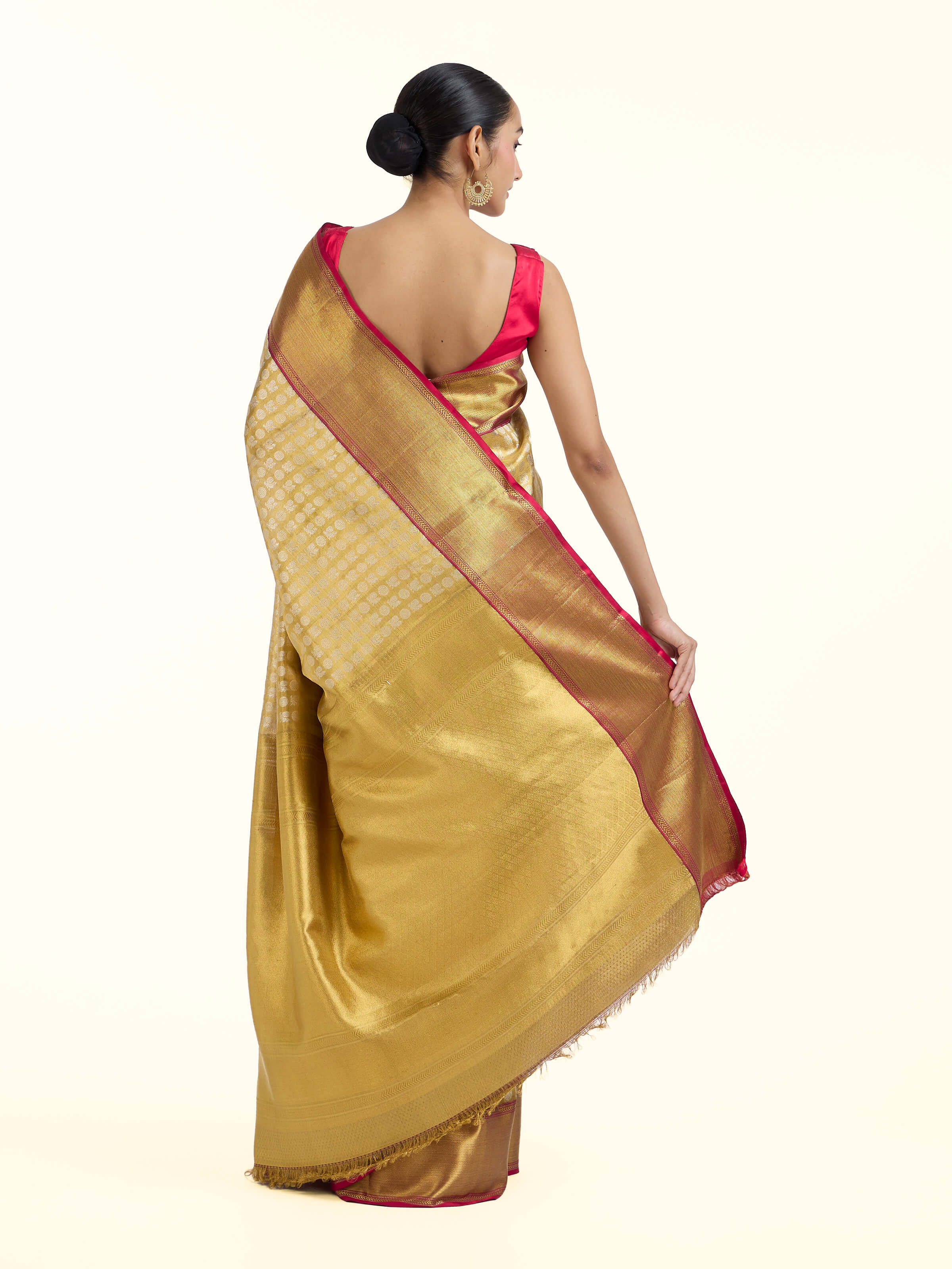 Back view of gold silk Kancheepuram saree with grand pallu design