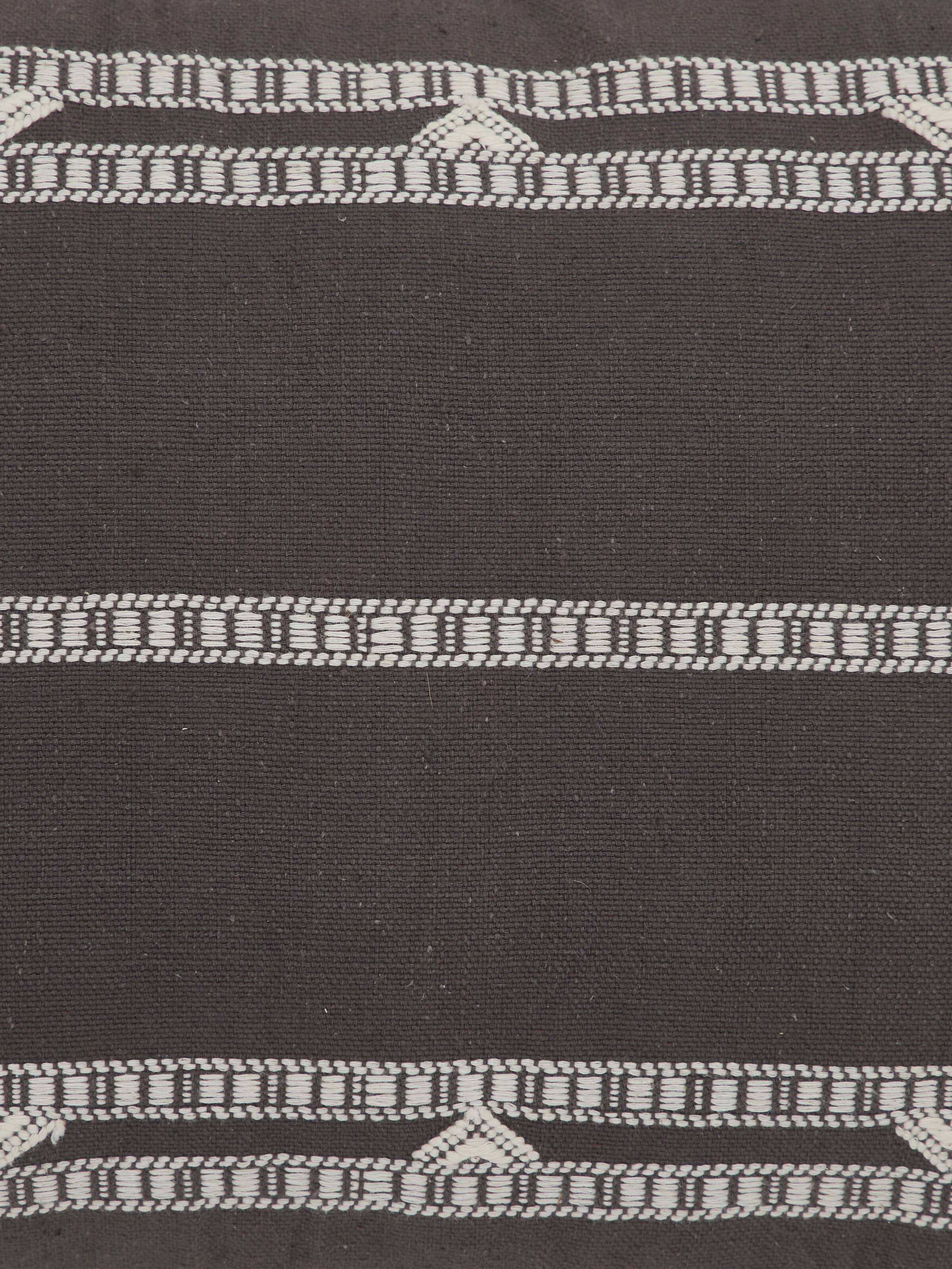 Detail shot of Anek Coffee Cushion Cover showing textured cotton weave and Bhujodi stripes