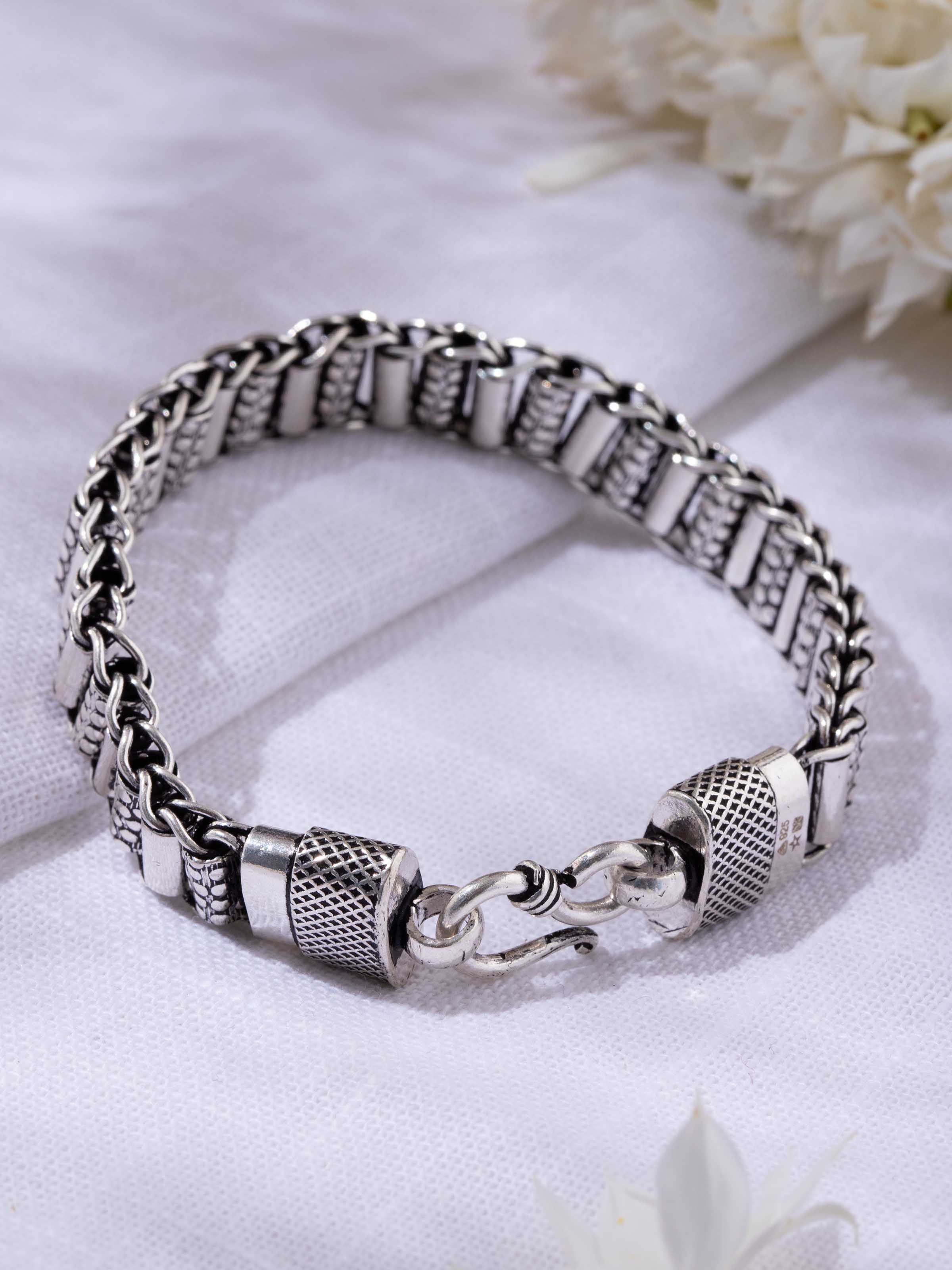 Lifestyle angled view showing texture and smooth finish of bracelet.