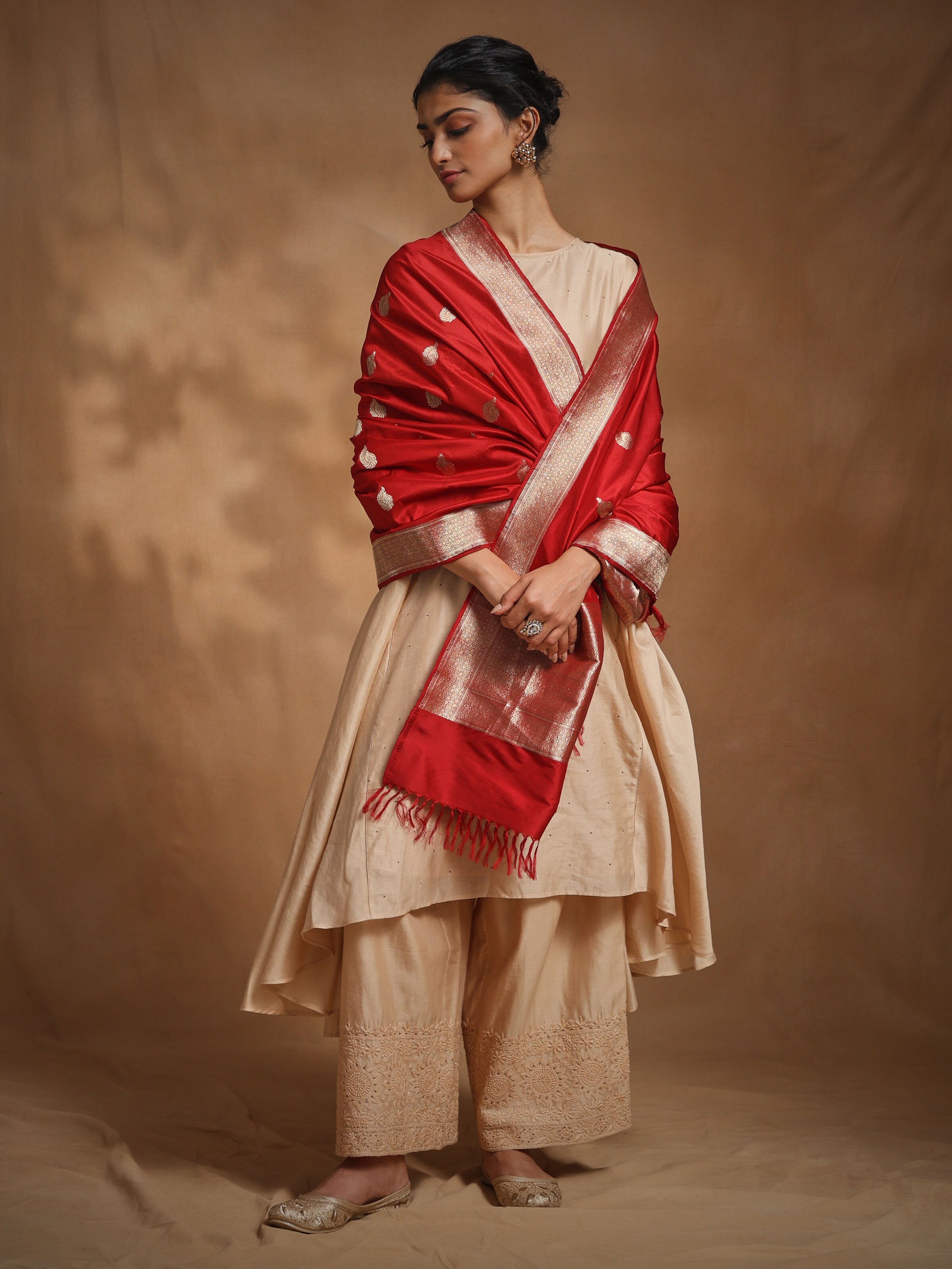 Side view of red Banarasi silk kadwa handwoven dupatta showcasing weaving texture