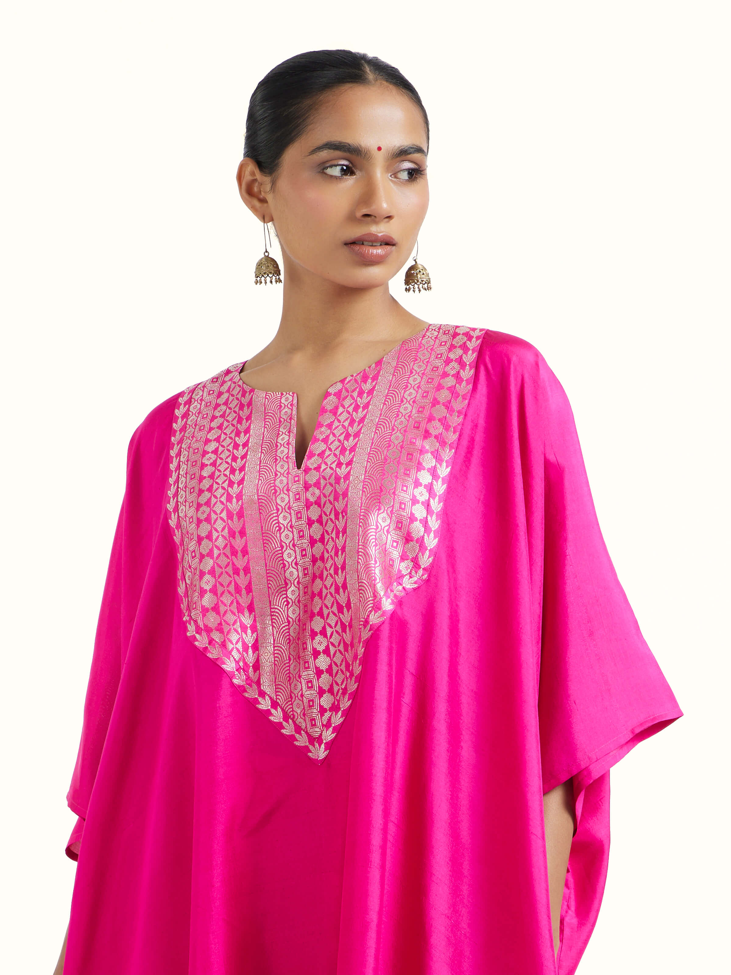 Angled view of pink silk Banarasi co-ord set highlighting woven patterns