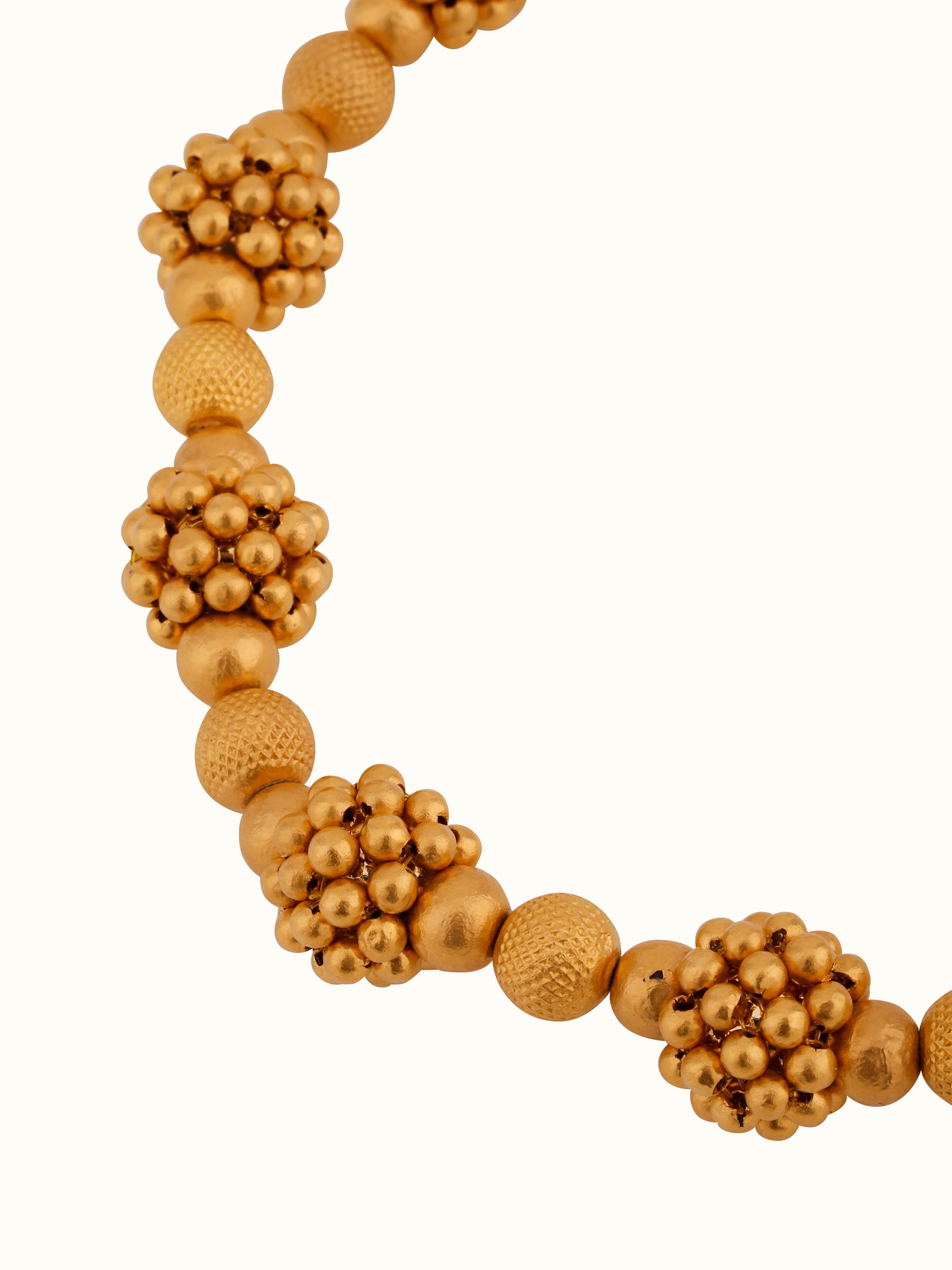 Side view of Thushi 22 karat collar necklace