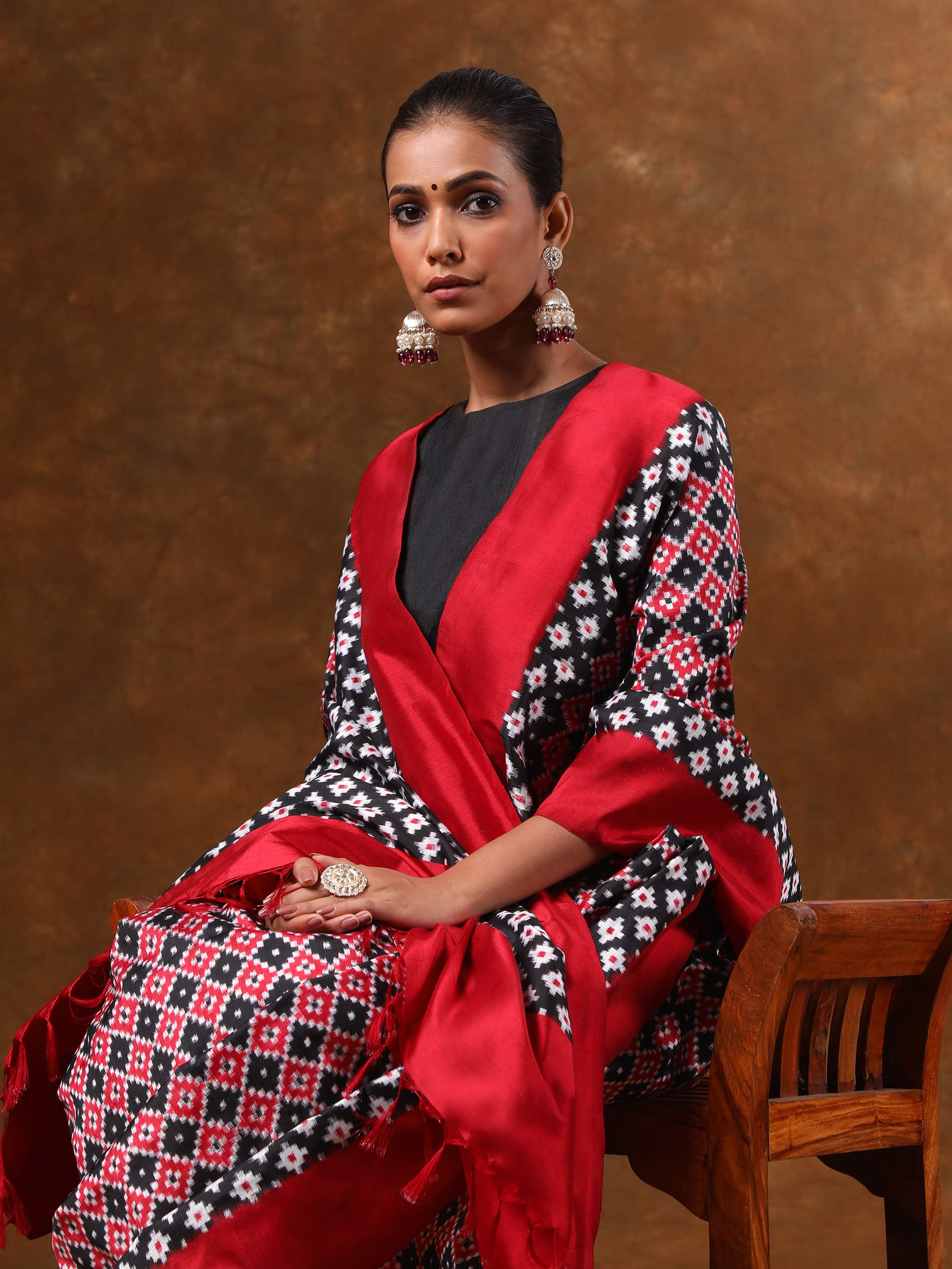 Alternate lifestyle view of black silk double Ikat saree highlighting traditional design