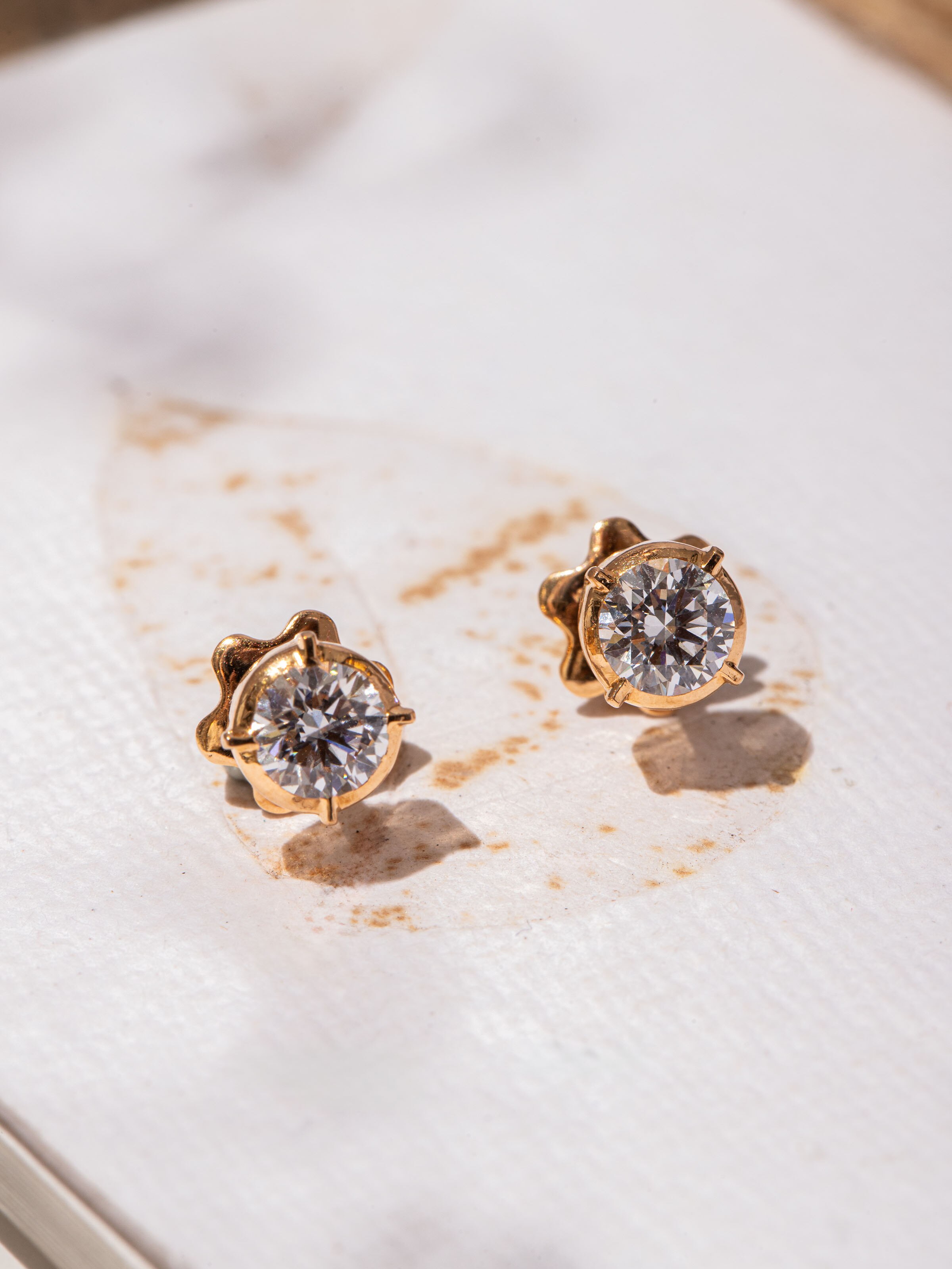 Detail shot highlighting the meticulous gold bead detailing of Close-setting 22 Karat Gold Studs.