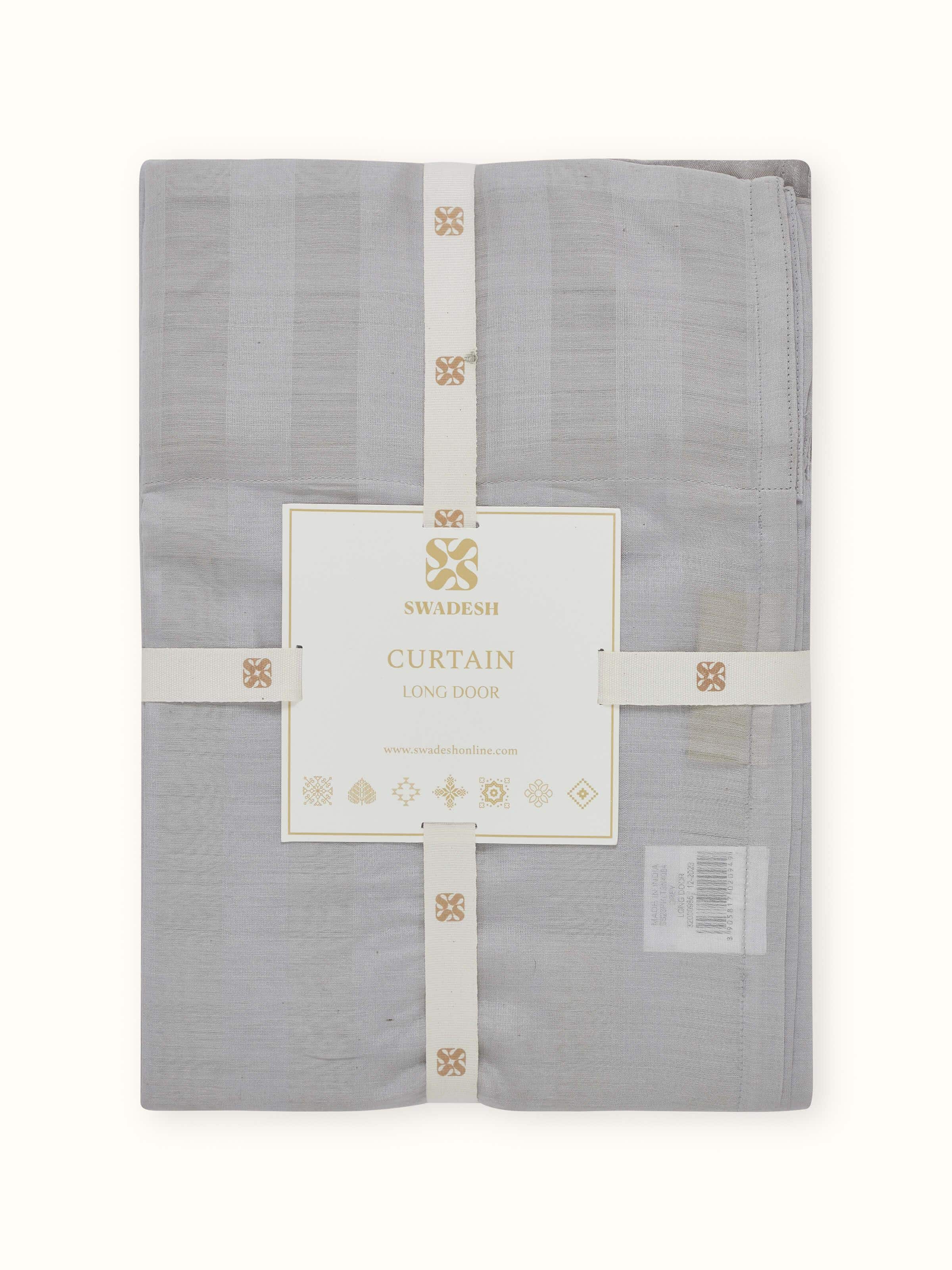 A close-up of the handwoven surface of the Pragya Grey Maheshwari Sheer Curtain, highlighting the artisanal texture and linear design.