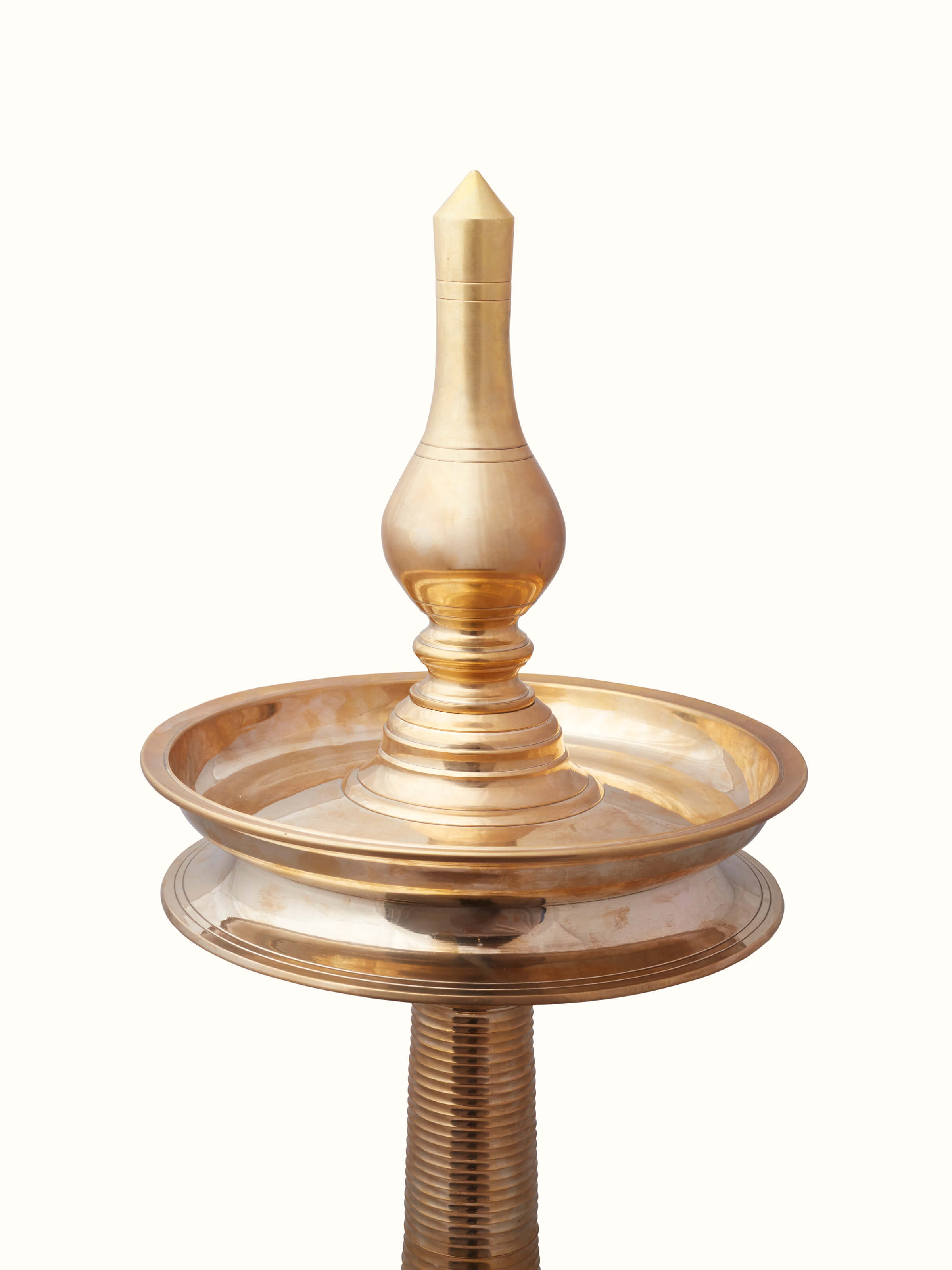 Angle view of Vilakku brass stand diya emphasizing traditional design elements