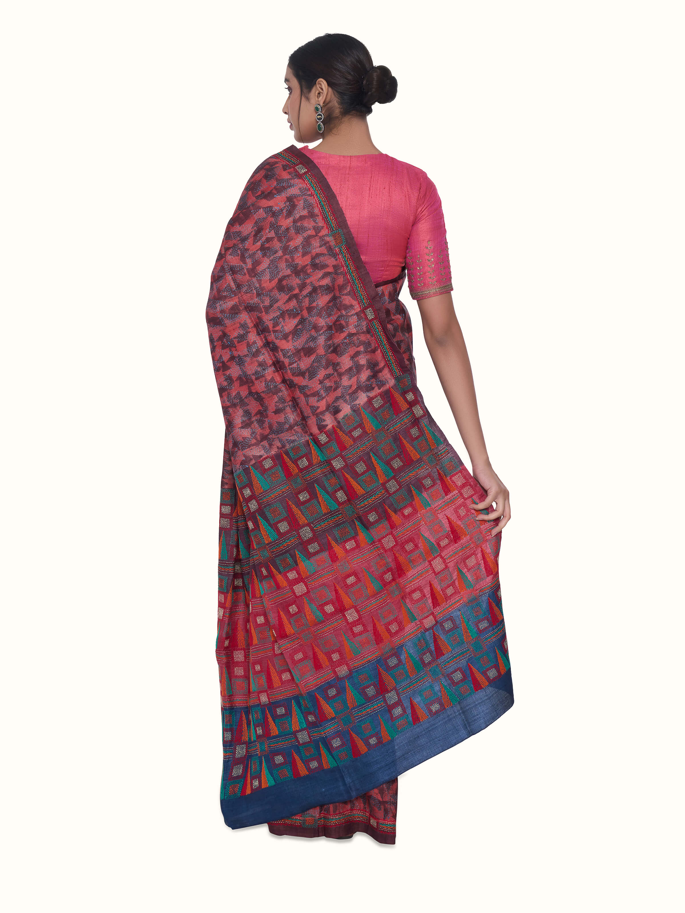 Back view of red tussar silk discharge printed Kantha embroidered saree displaying pallu design