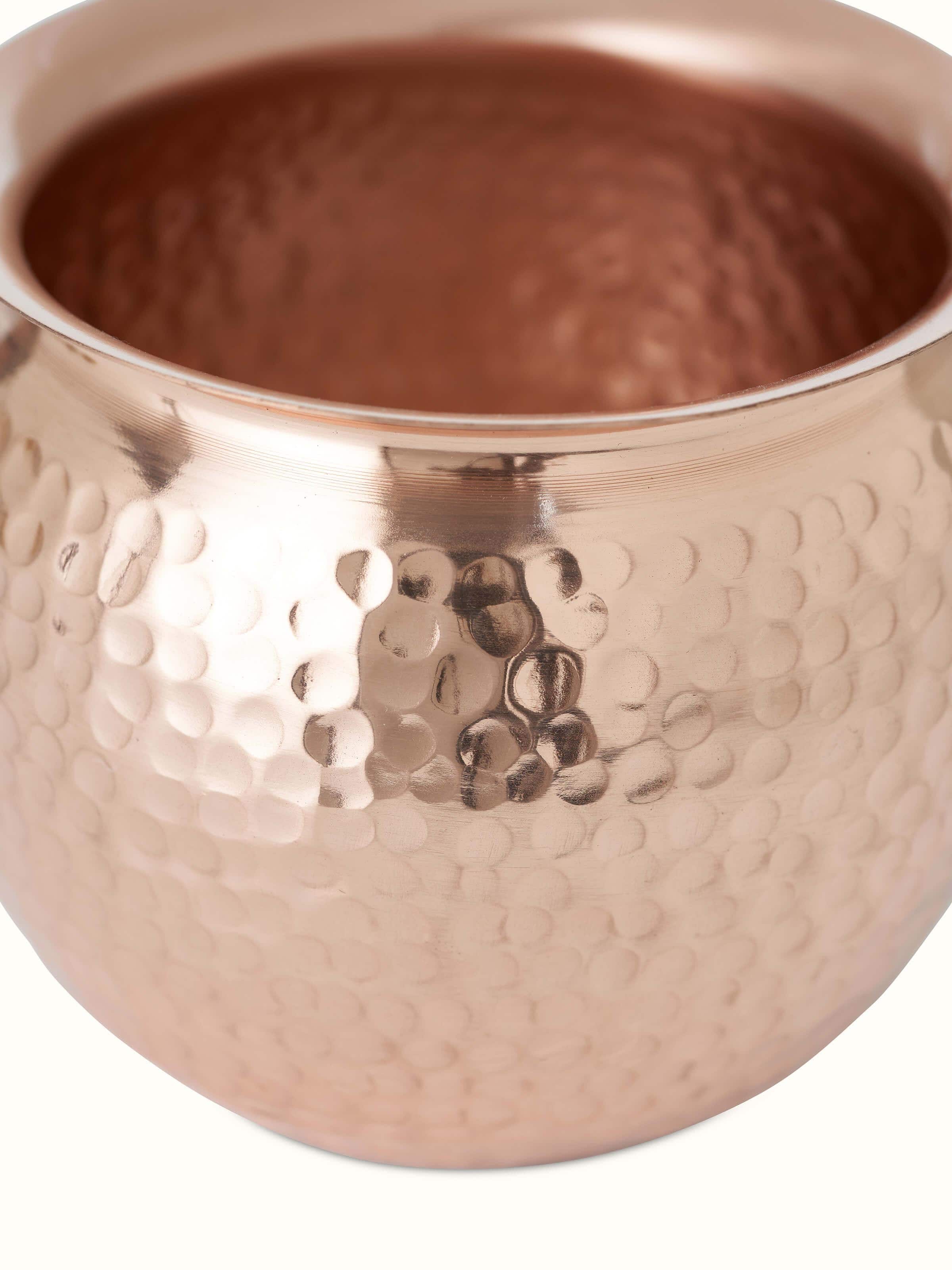 Close-up view of Polished copperware kalash