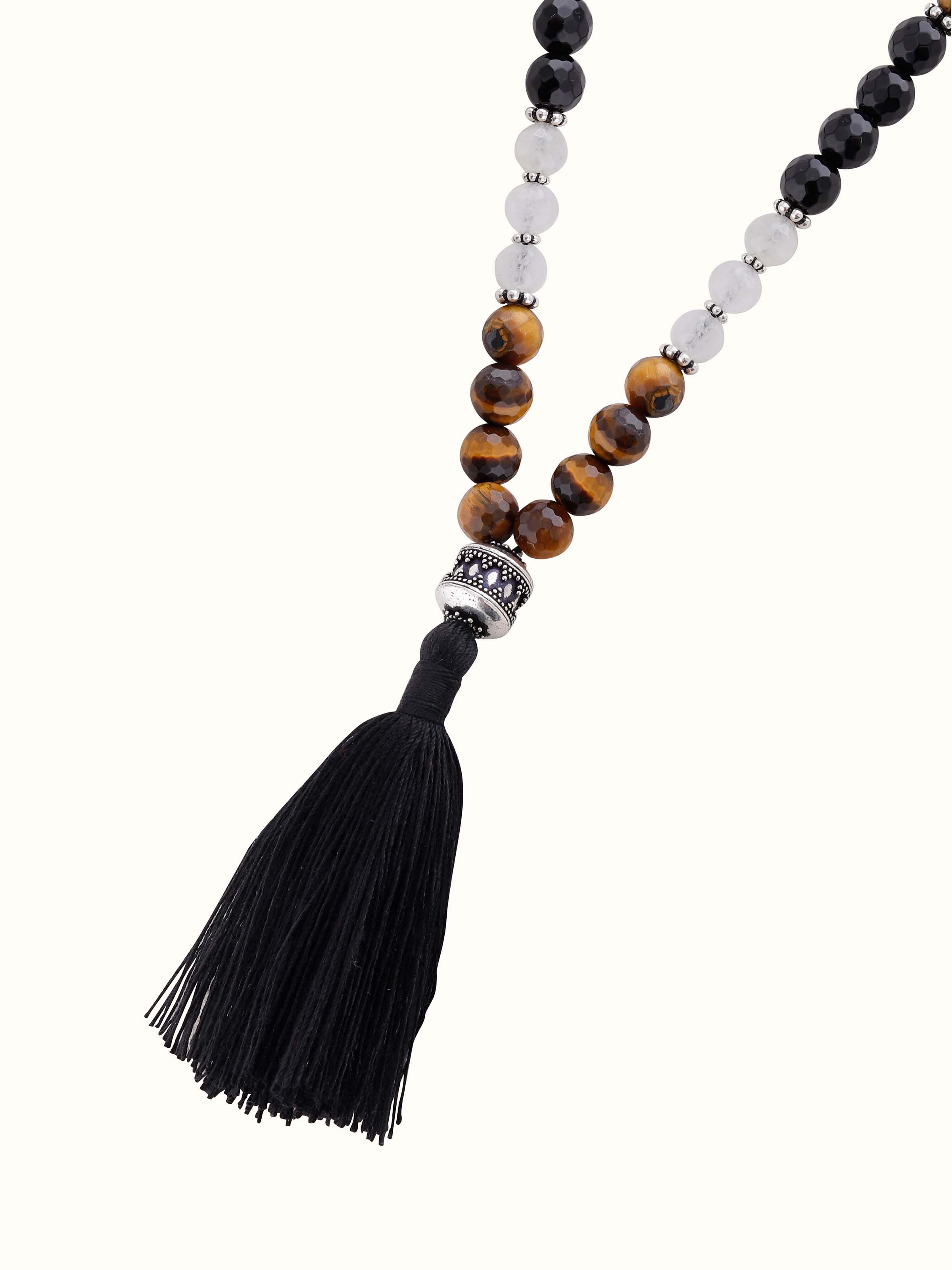 Overhead view of mala with healing gemstones laid flat, showcasing smooth finish and design