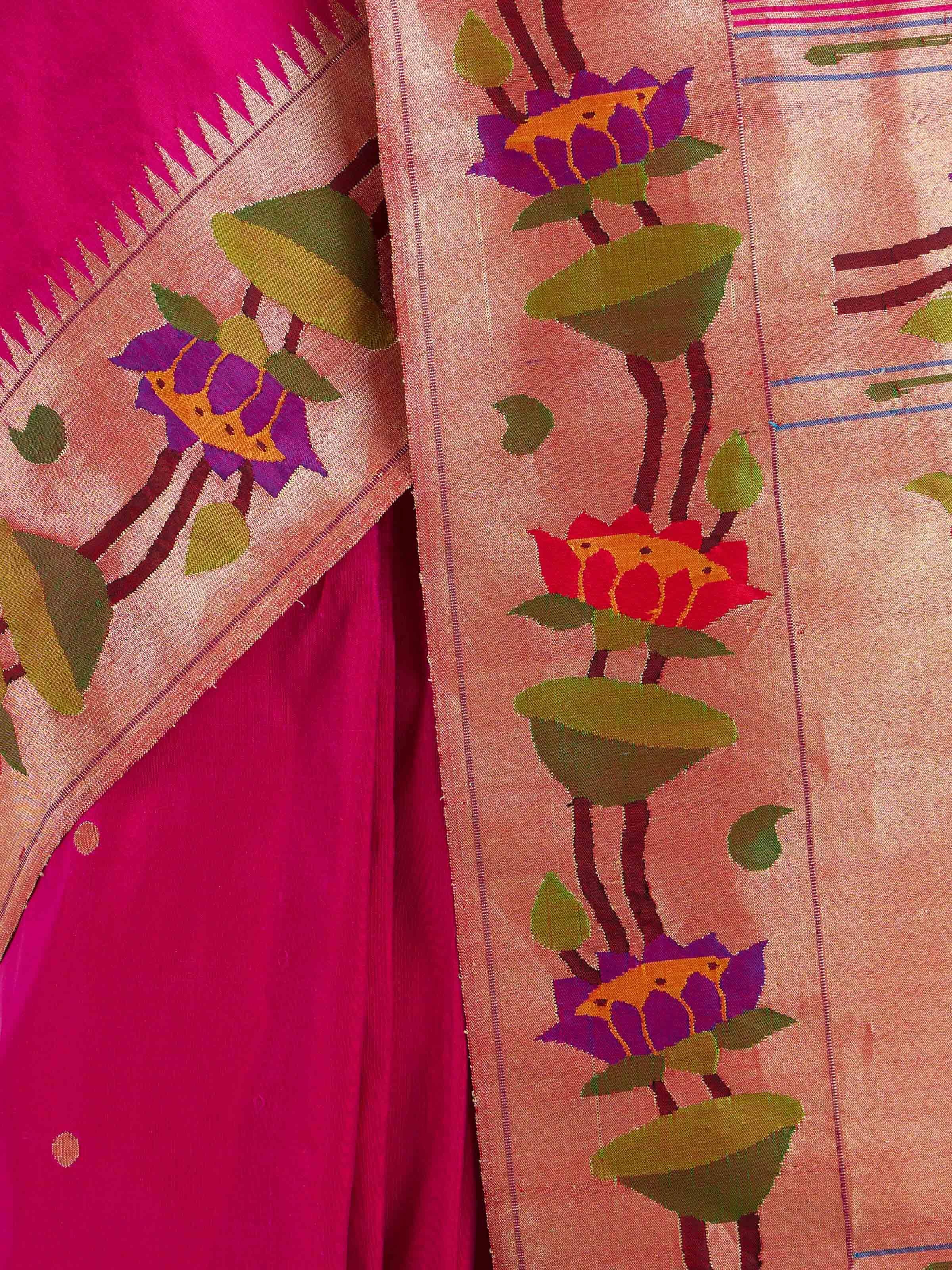 Detail view of purple silk Paithani saree showing silk texture and intricate weaving